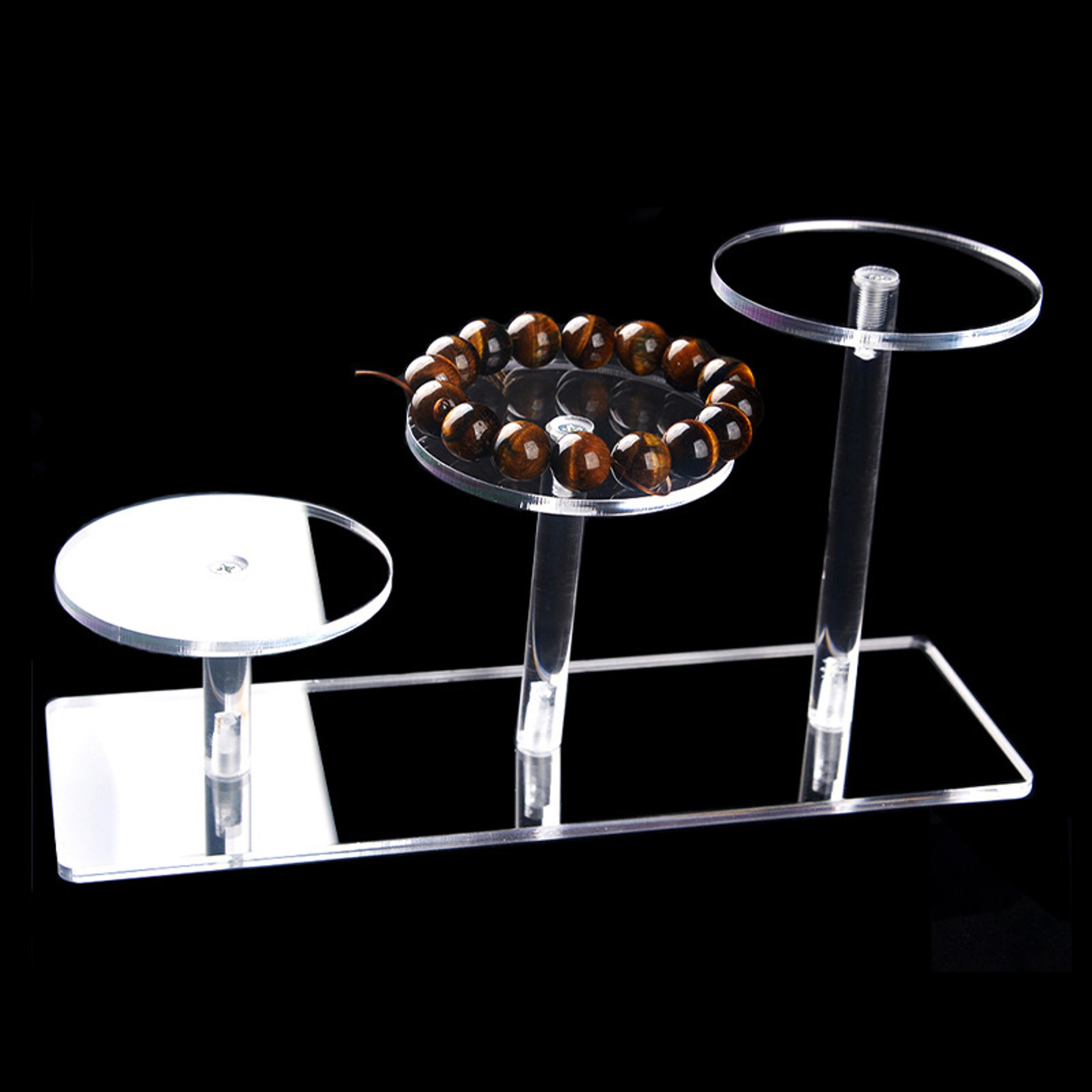 transparent round acrylic display stand with rectangular base for perfume, dolls, jewelry, and cosmetics