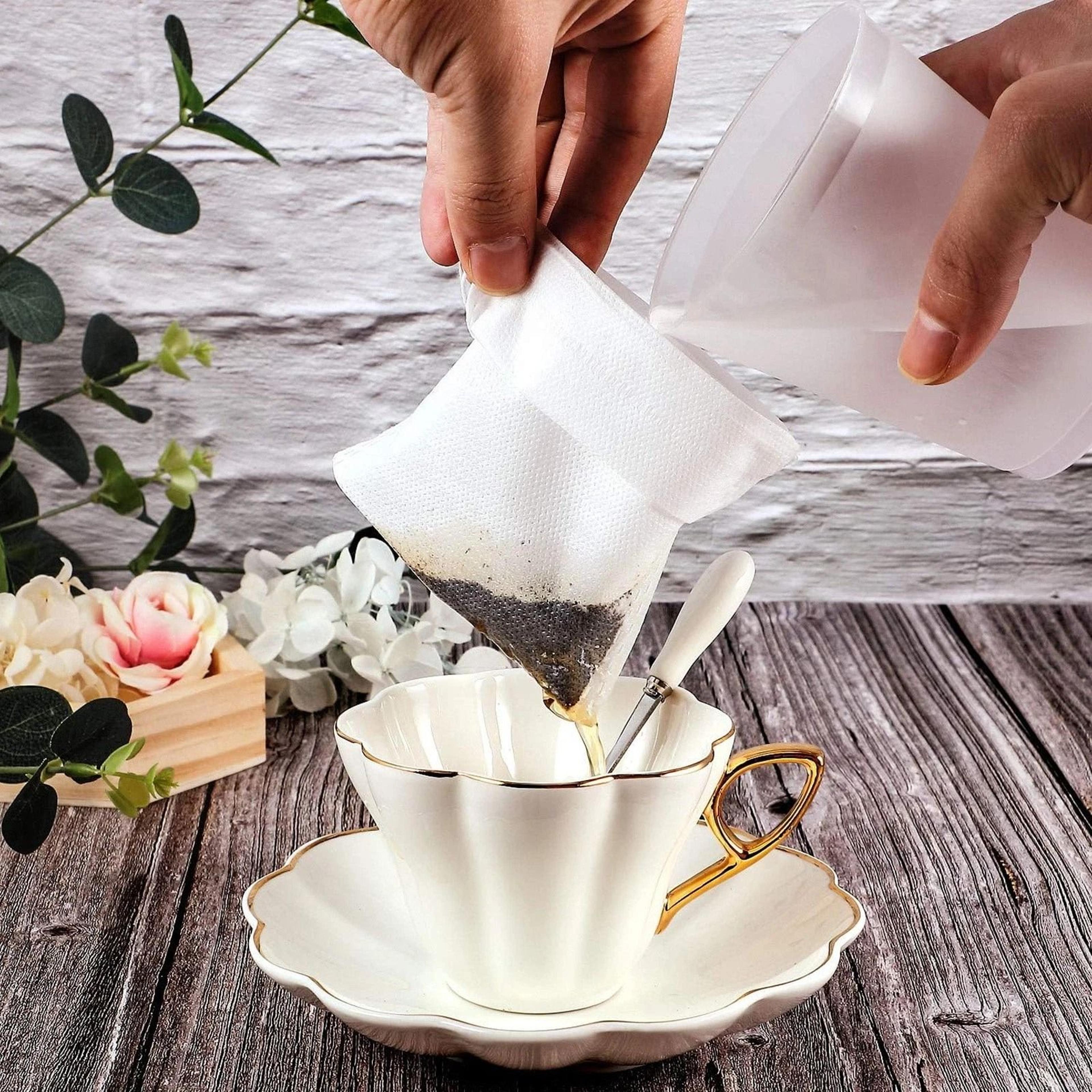 disposable tea filter bags with drawstring for loose leaf tea and coffee brewing