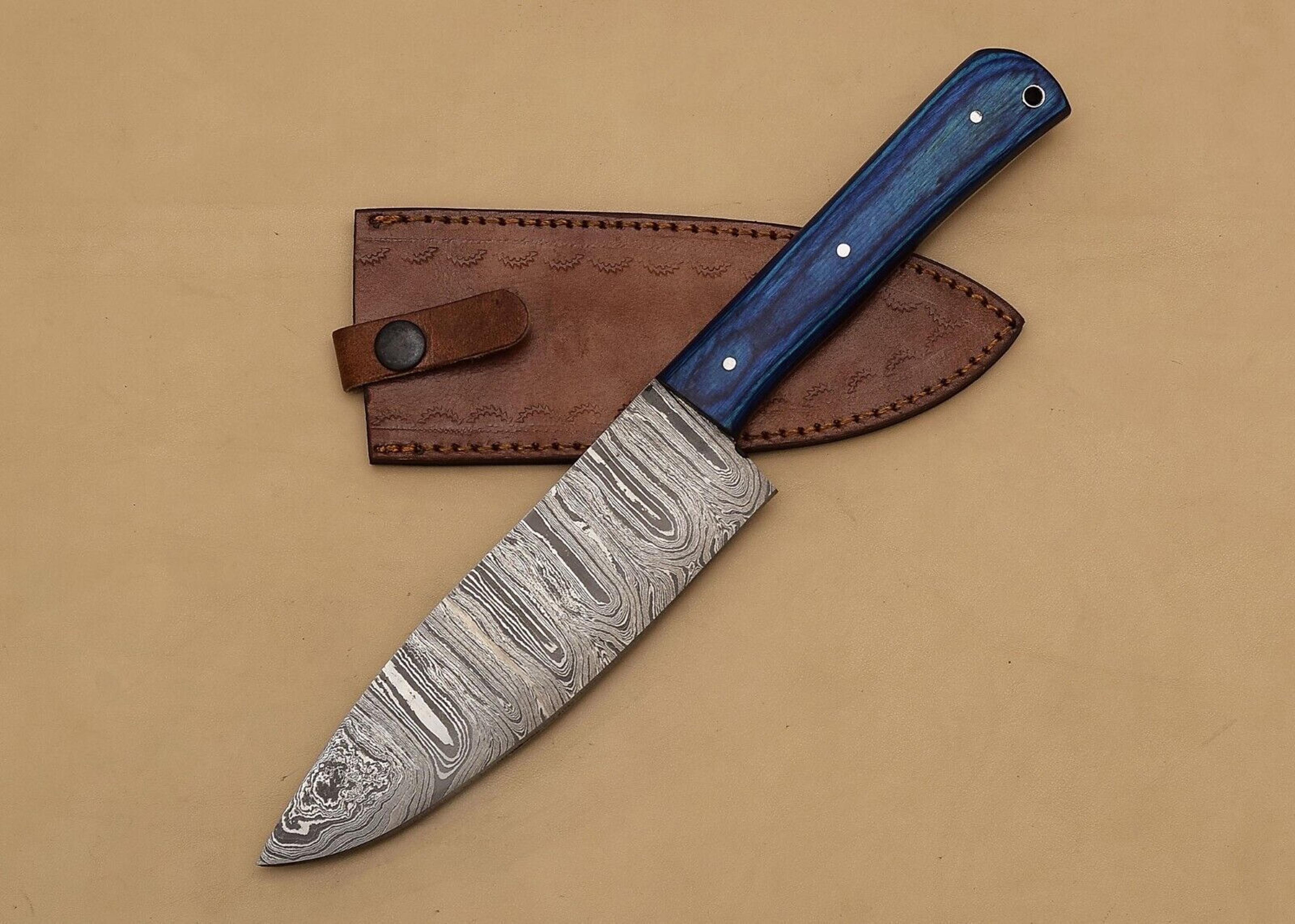 handcrafted damascus steel chef knife with 7" blade and 5" pakka wood handle