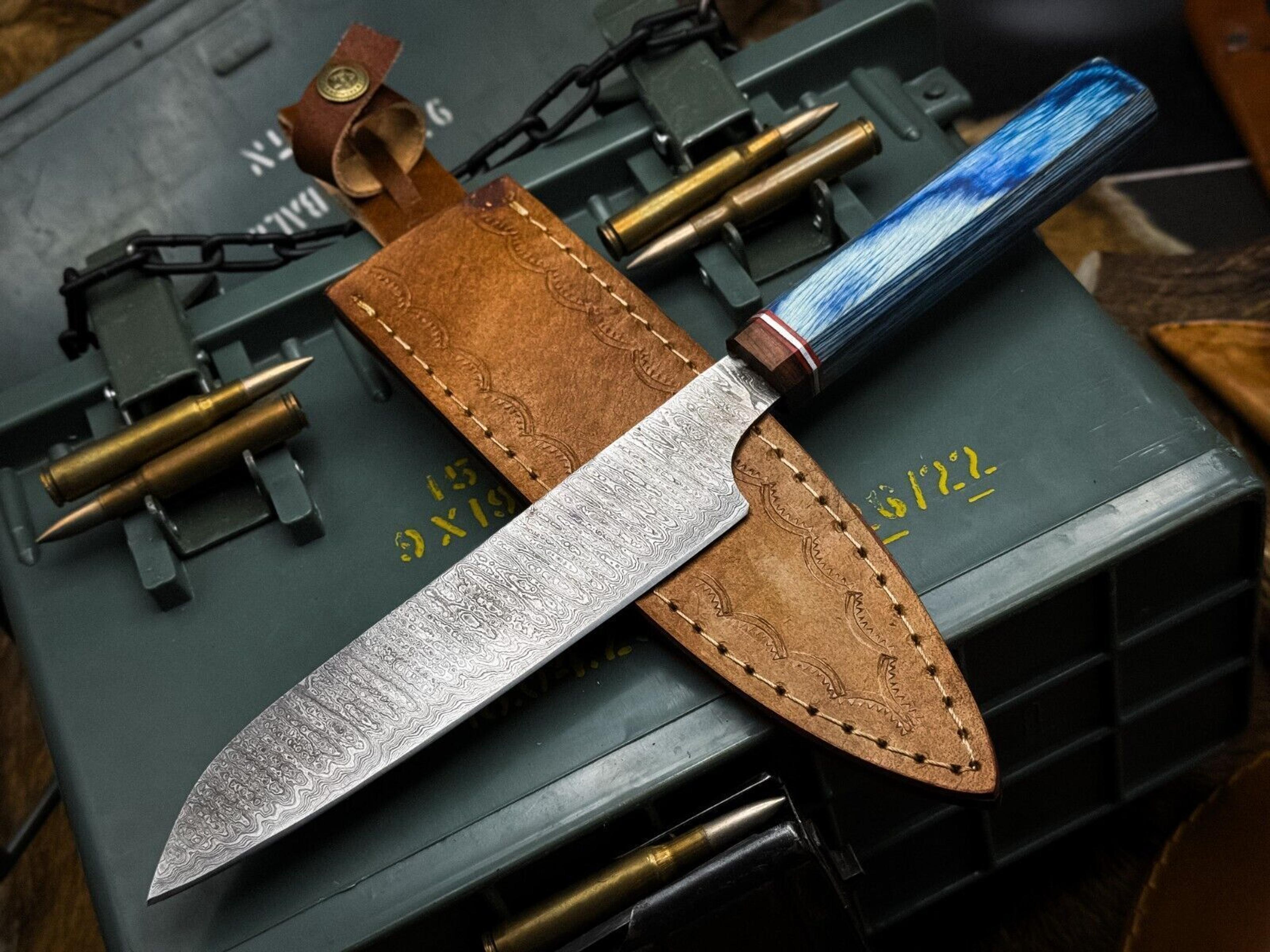 custom forged damascus kitchen knife with wooden handle and leather sheath