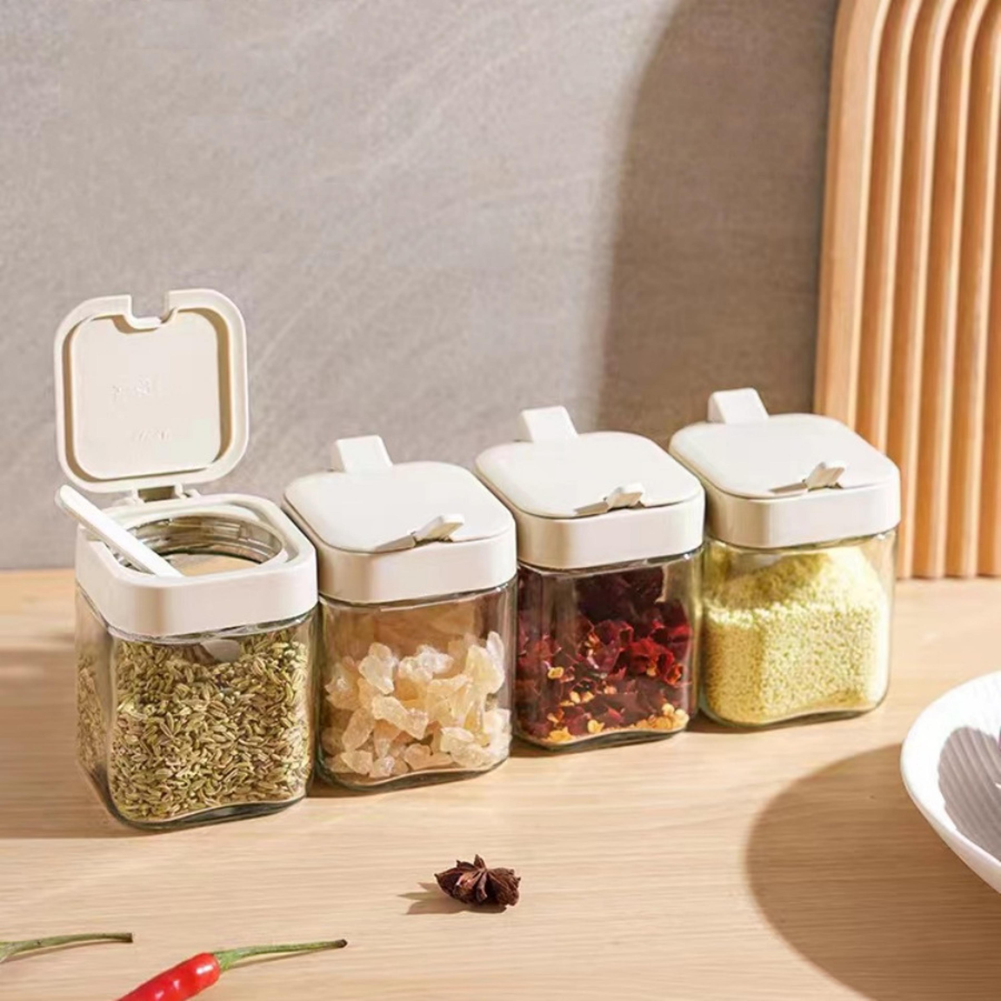 glass spice boxes, seasoning jar with spoon, salt shaker container for sugar, pepper, and spices