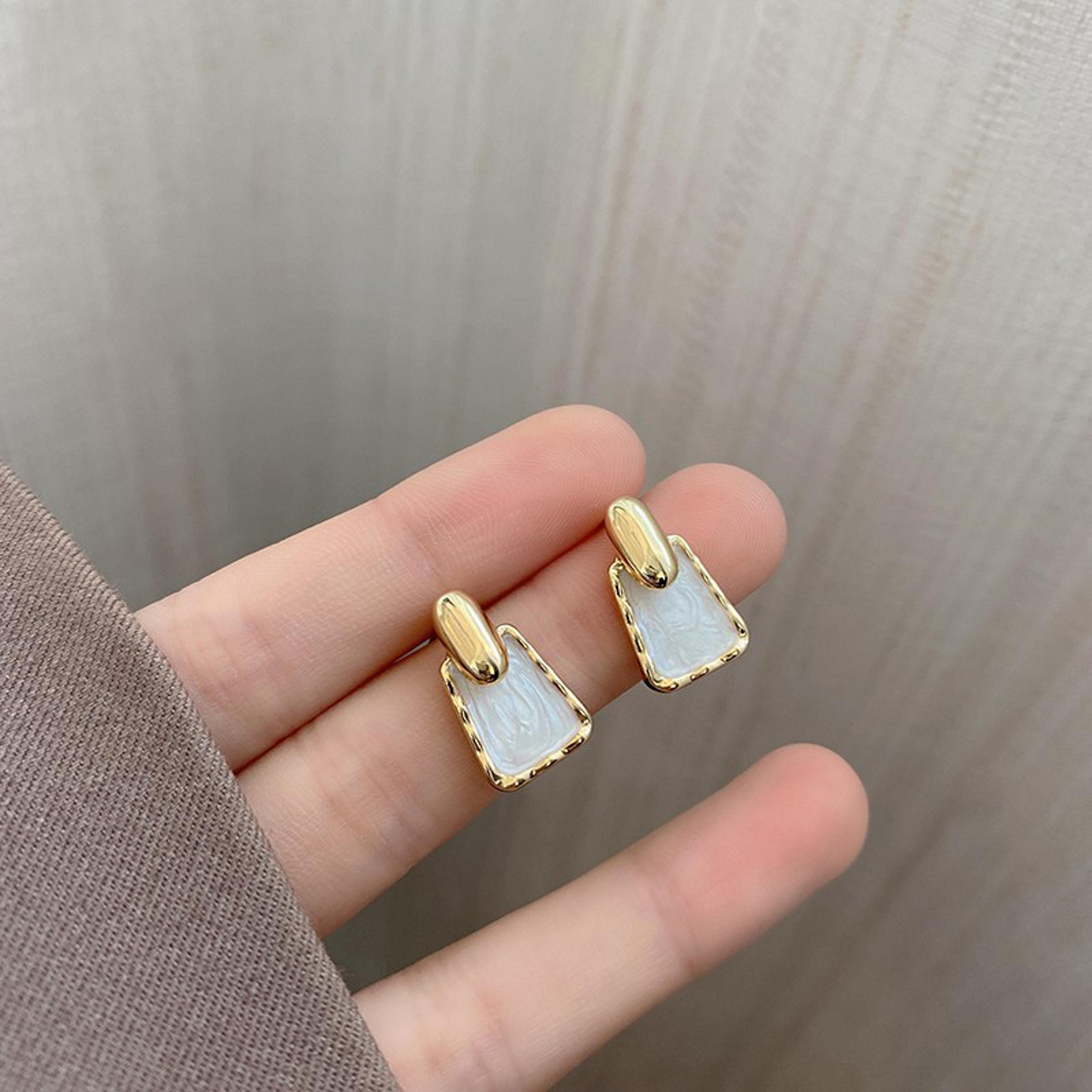 white enamel geometric stud earrings with gold accent for women
