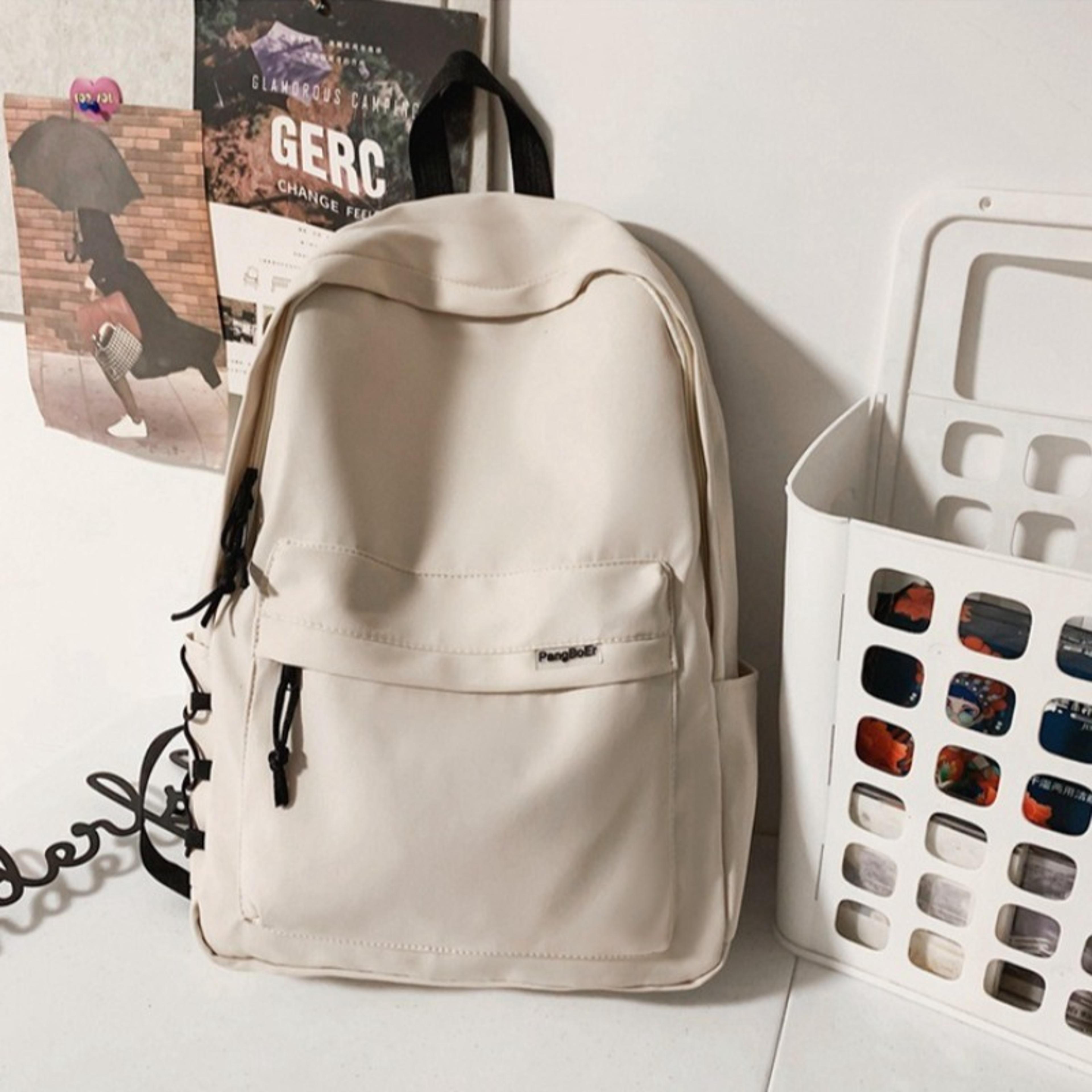 minimalist light weight school backpack with multi pocket storage and duck plush keychain