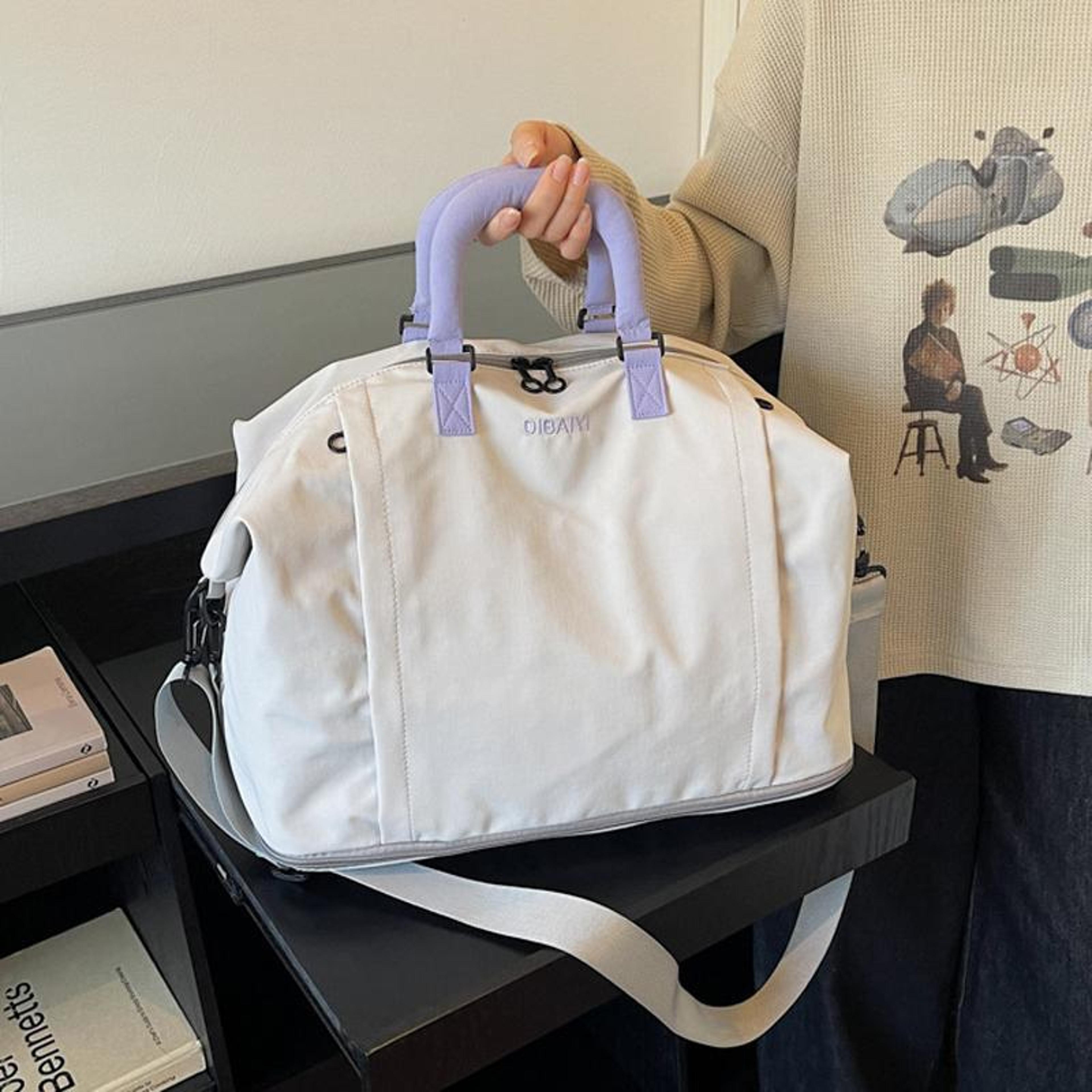 expandable travel duffel bag for women with wet pocket and shoulder strap grey