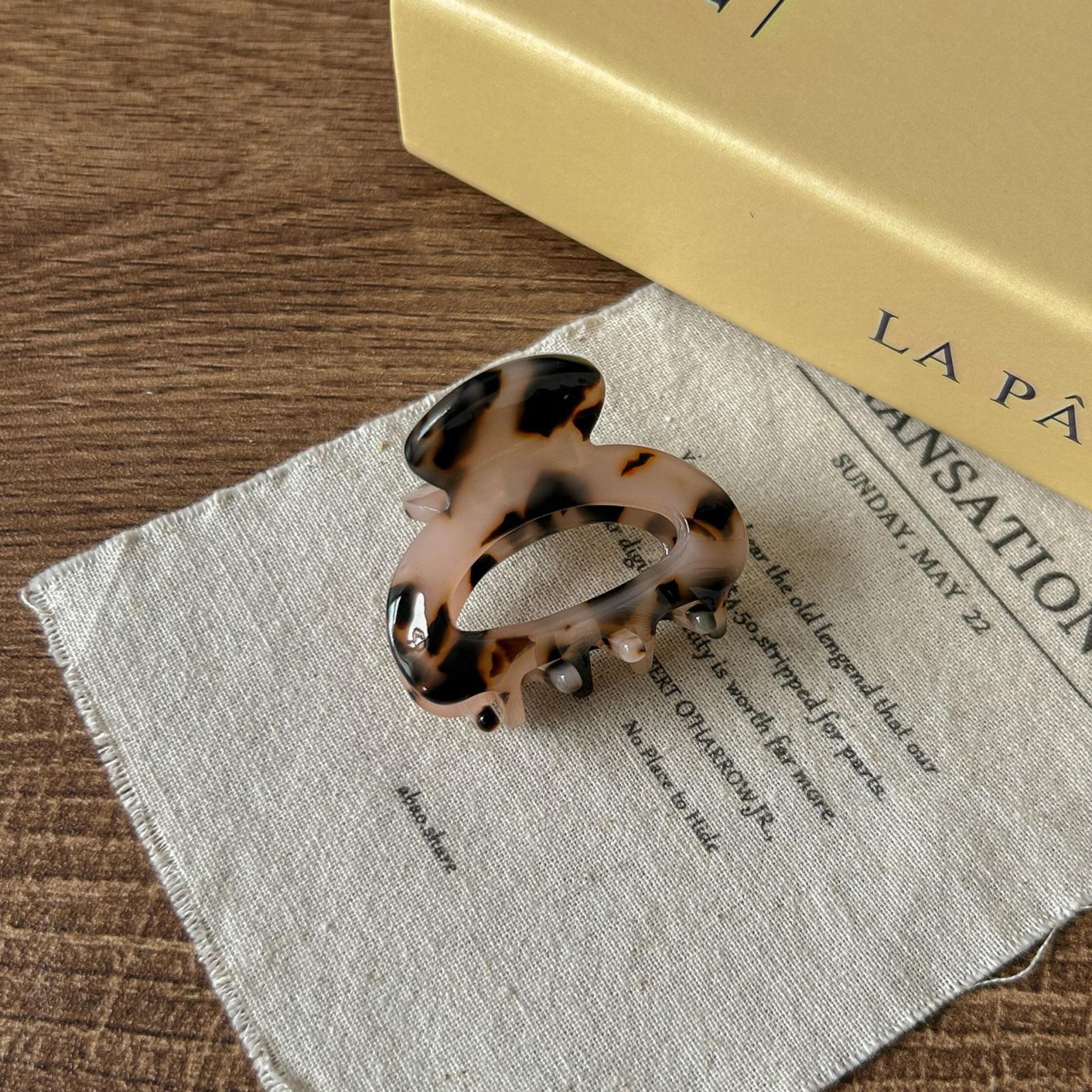 small tortoise shell acetate hair claw clip with non slip grip light leopard print