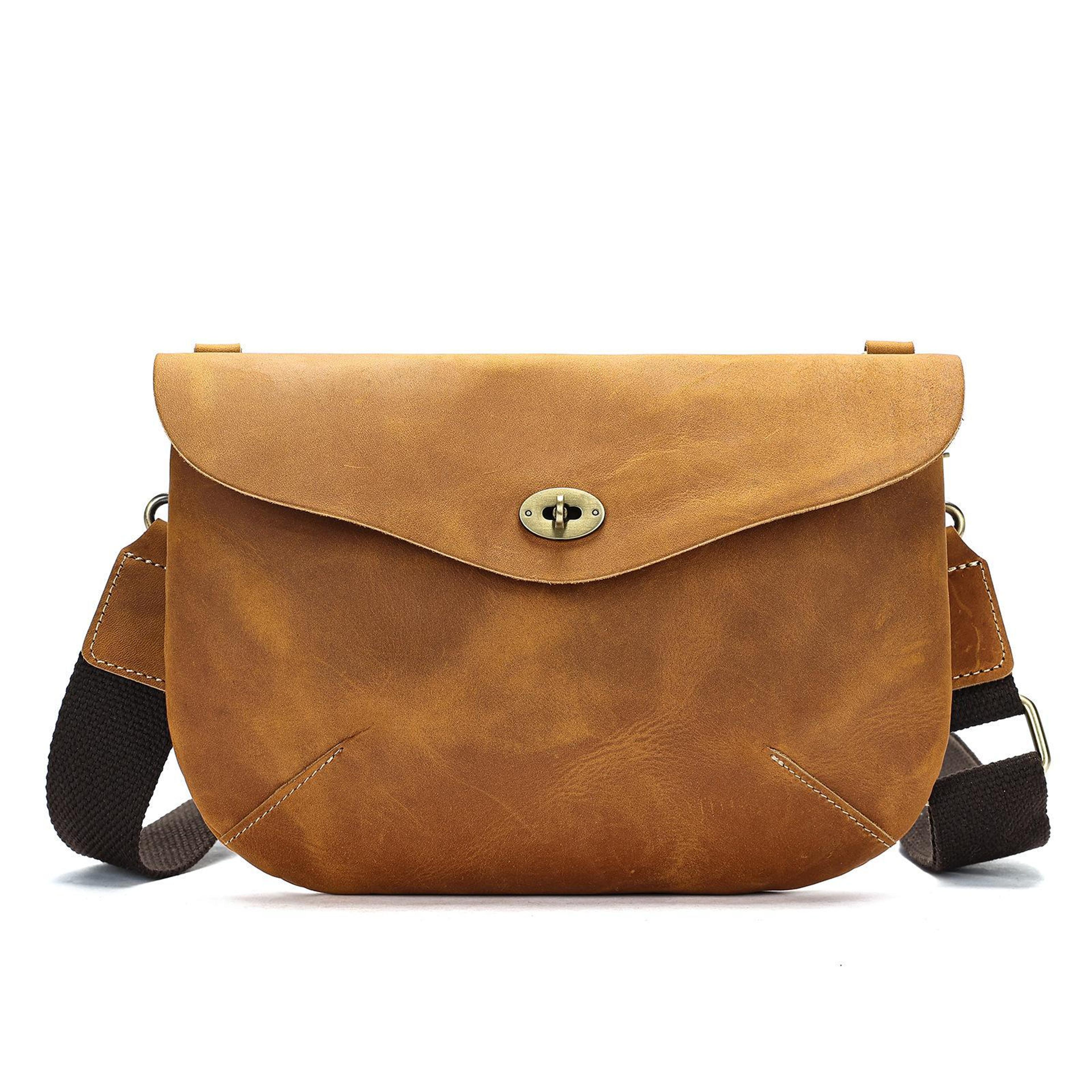 vintage leather crossbody bag with adjustable carry options and twist lock closure