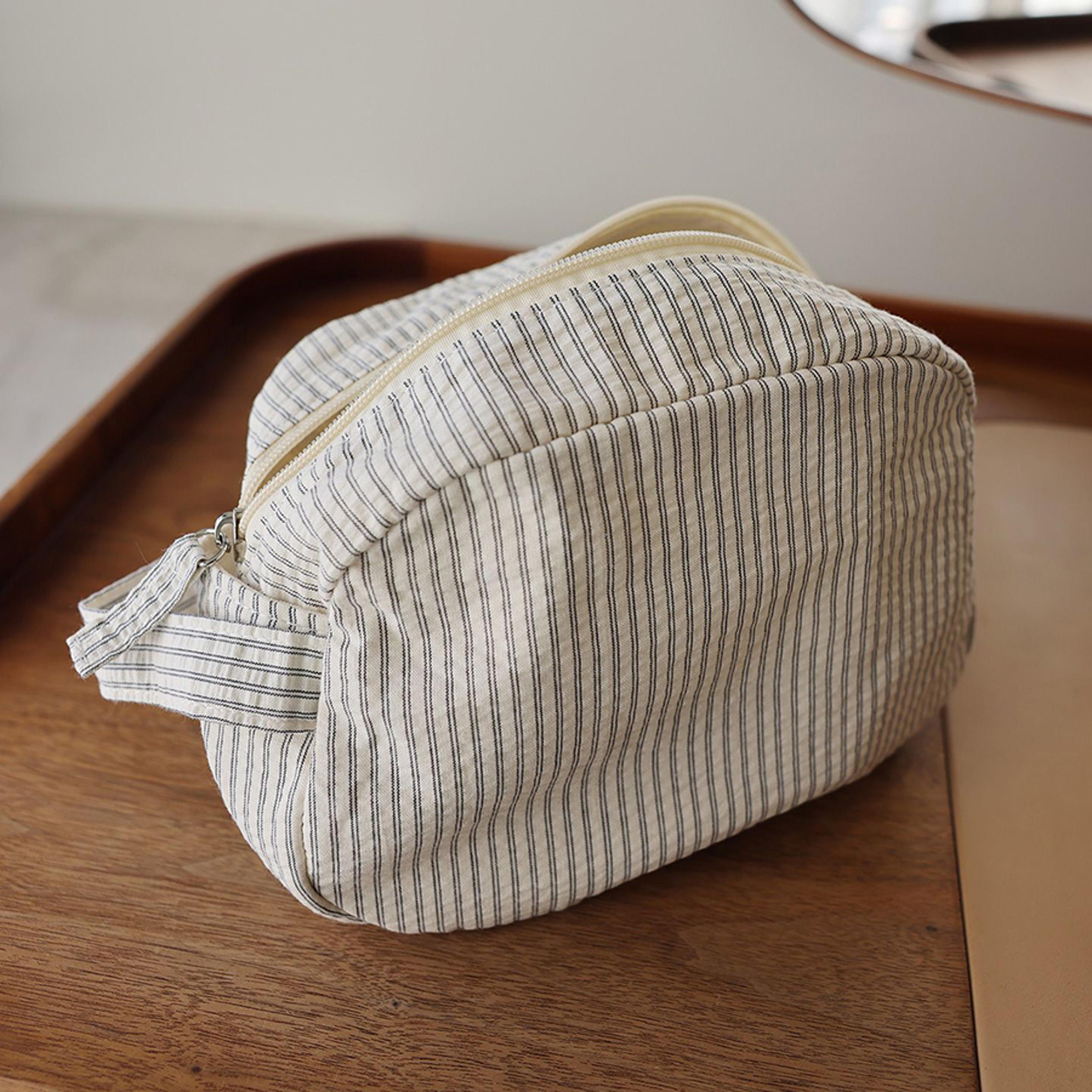 large capacity travel cosmetic bag with nylon lining and zipper closure