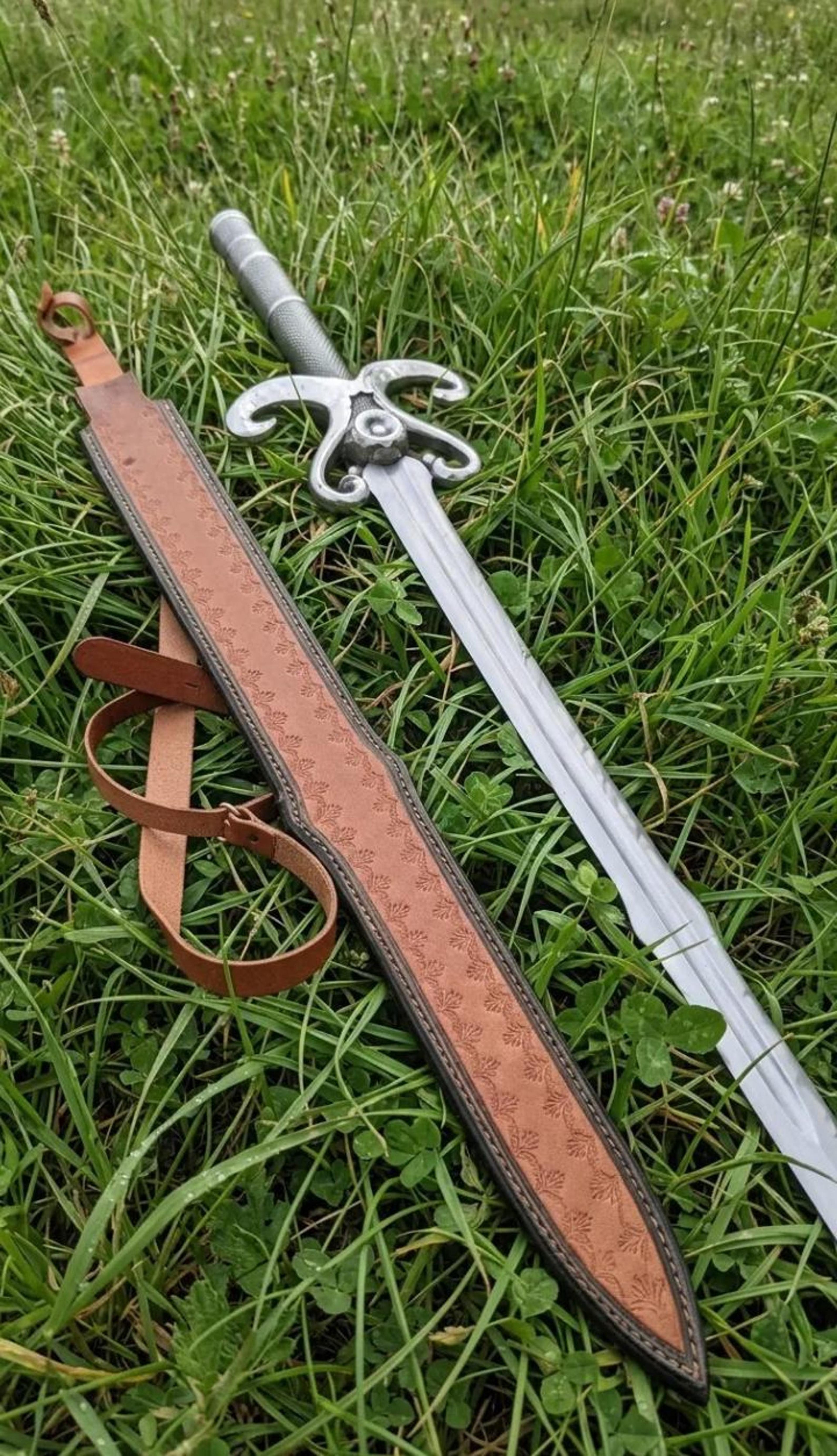 handmade scroll guard fantasy longsword with polished steel blade, black grip & embossed brown leather sheath