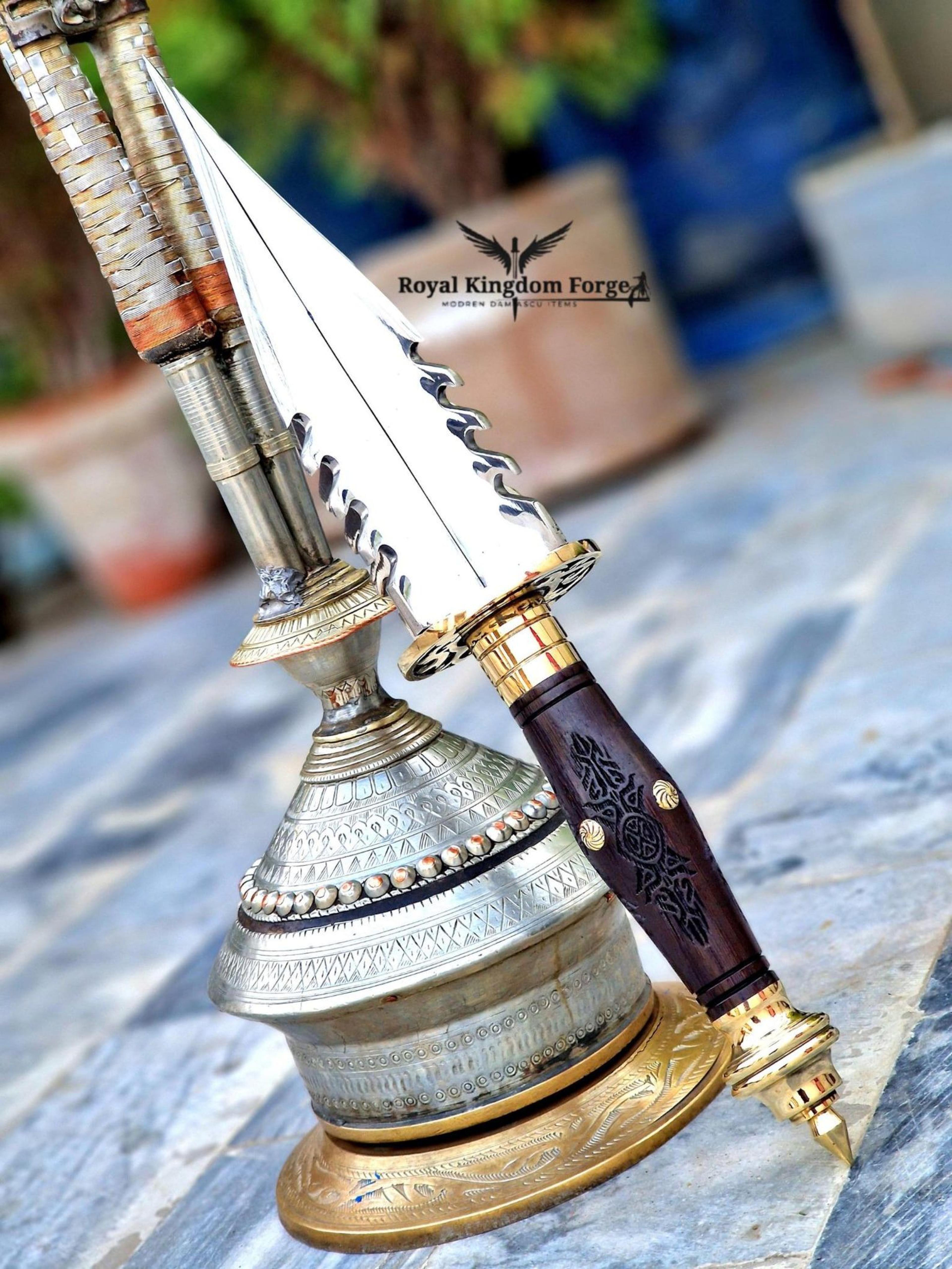 royal spearhead dagger with polished steel blade, carved wood grip & ornate brass fittings