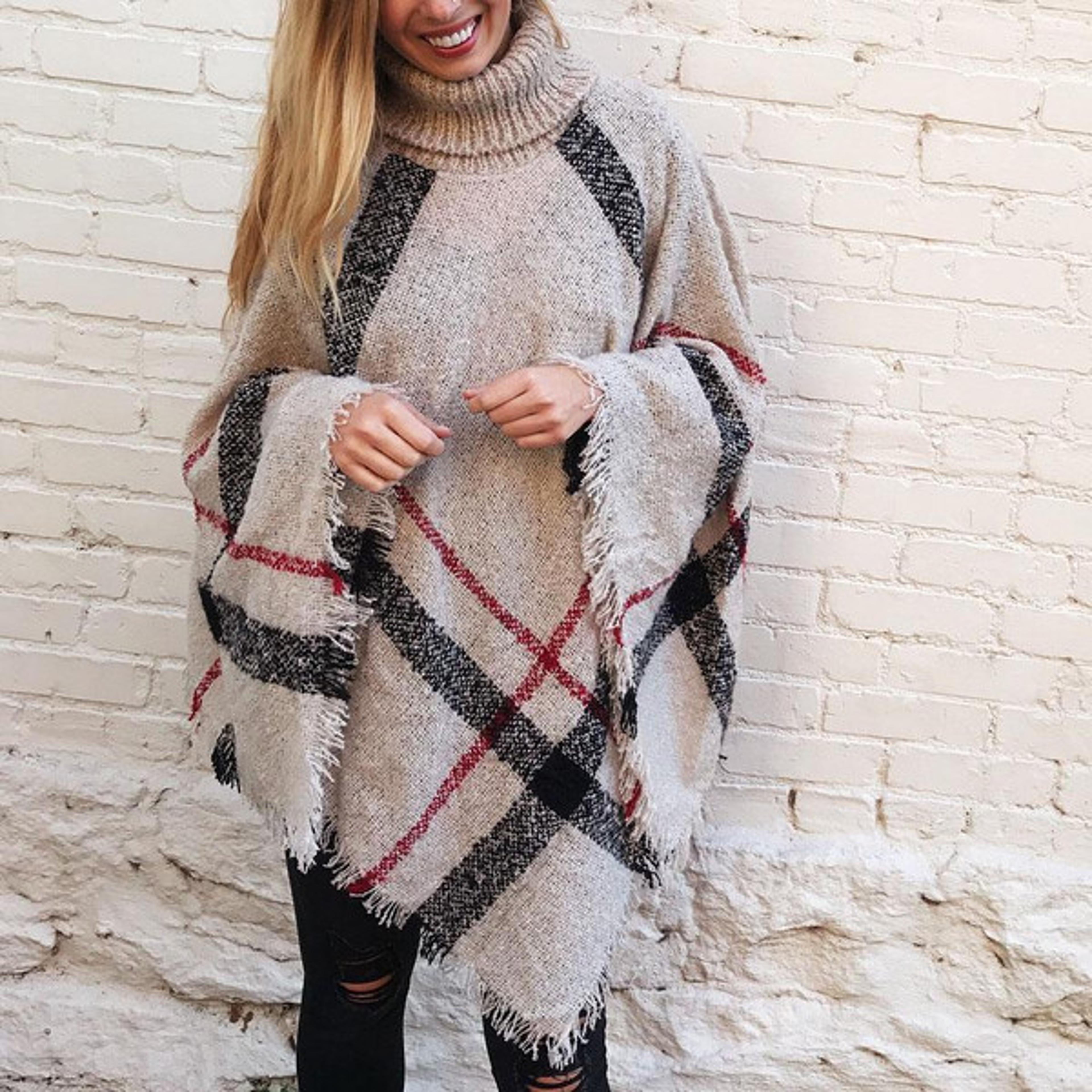 stay warm and stylish with our cozy poncho sweater