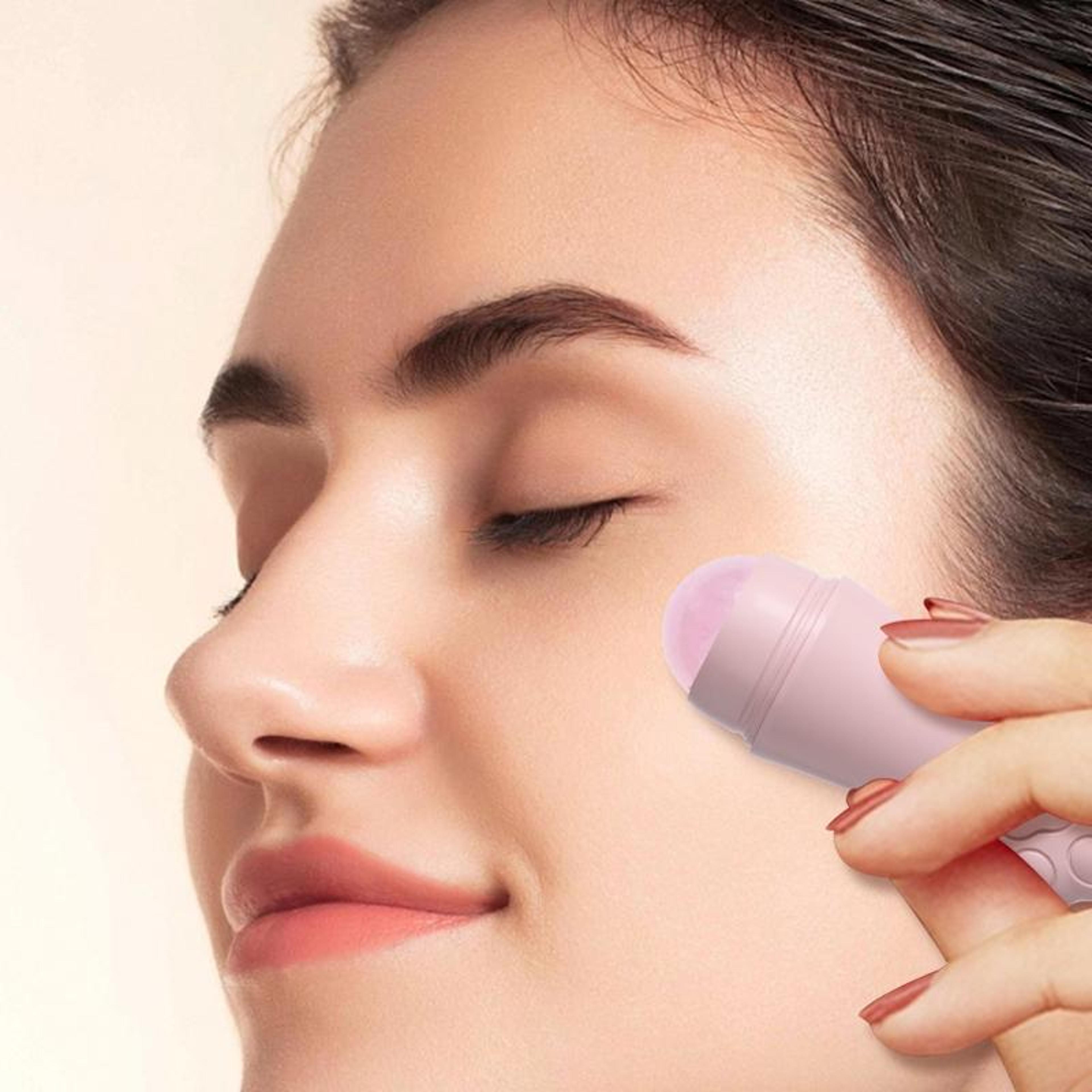 rose oil absorbing face roller for shine control and facial massage
