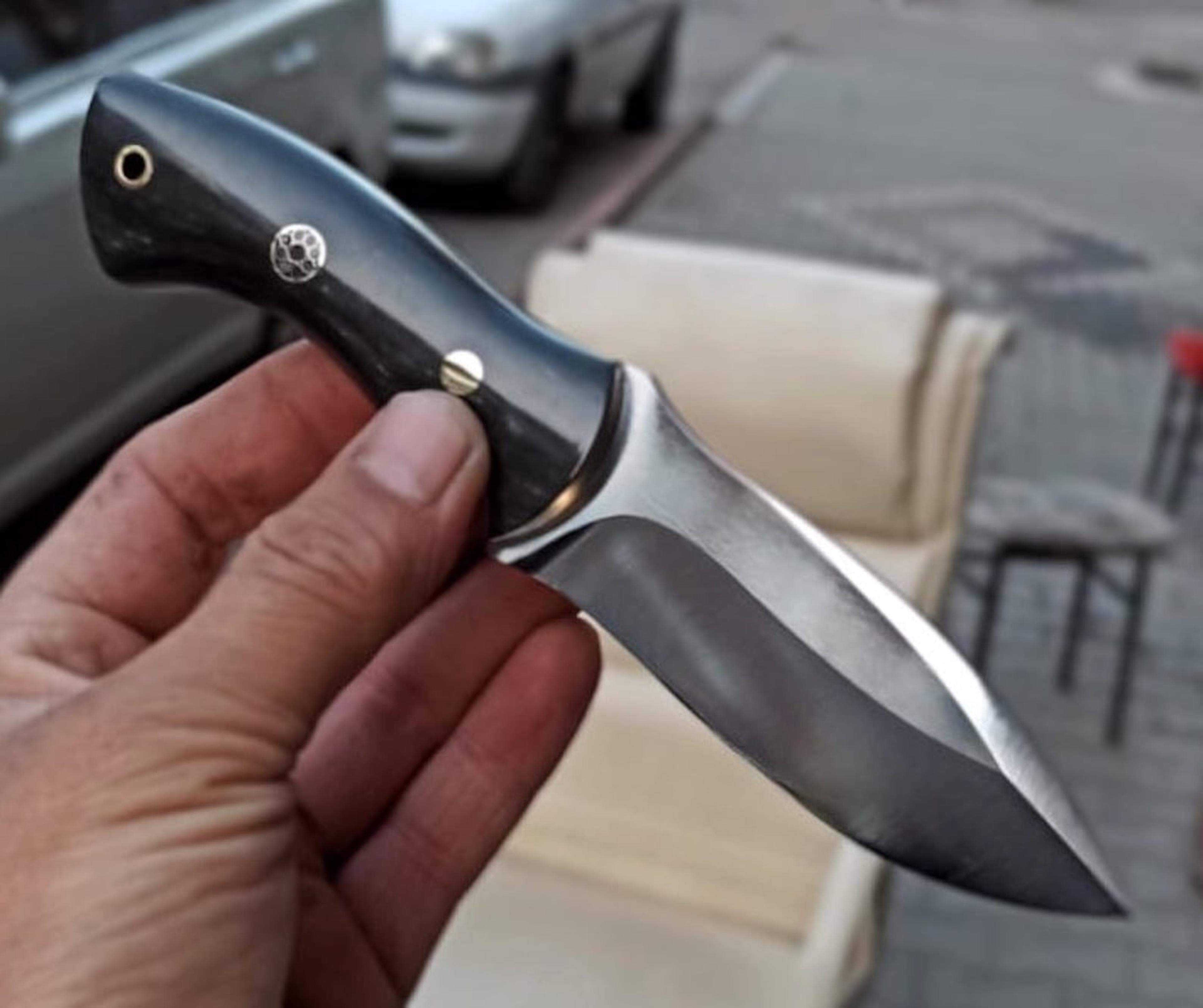 artisan camping knife with compact black handle & fixed blade design