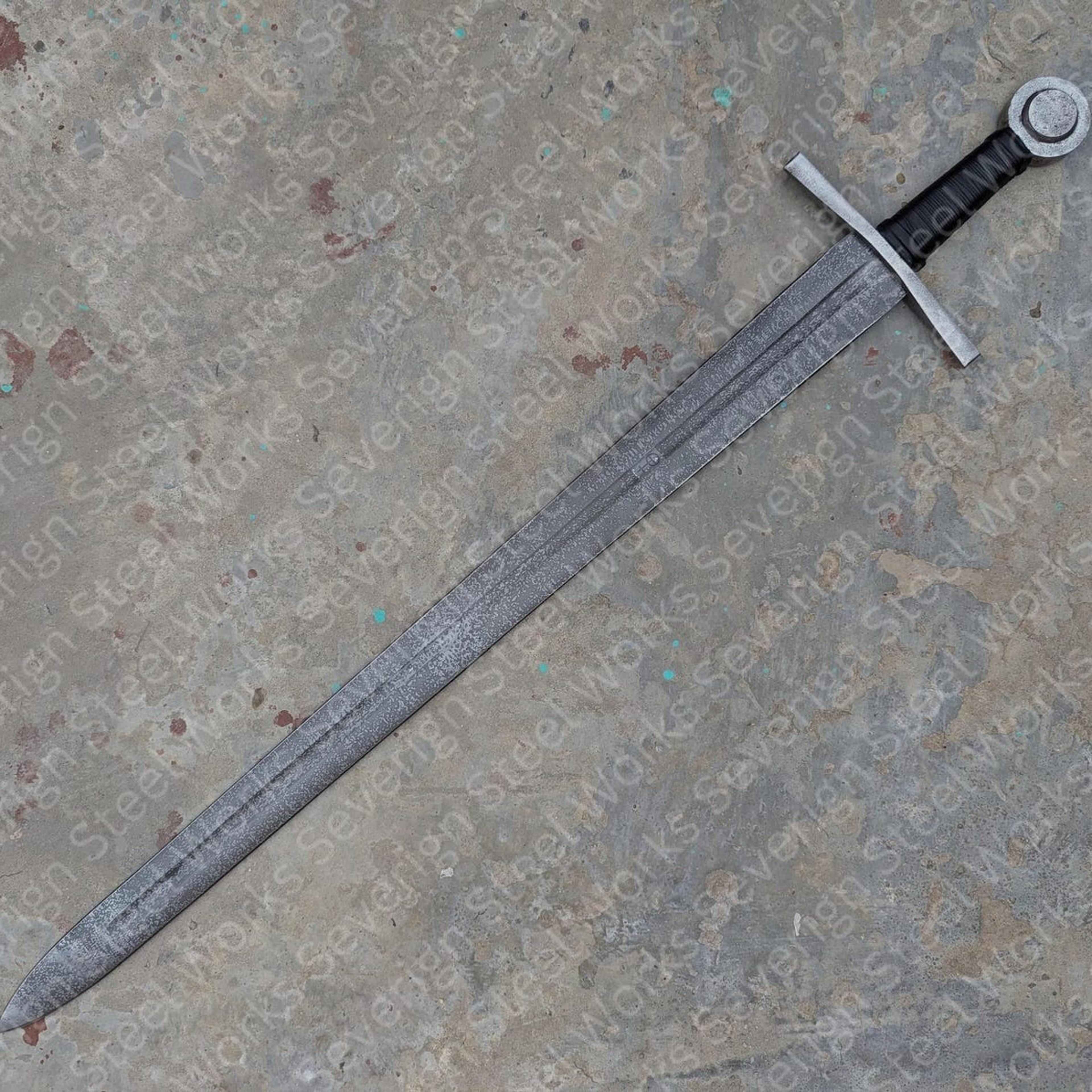 40in battle-worn medieval longsword with antiqued steel blade, black grip & disc pommel