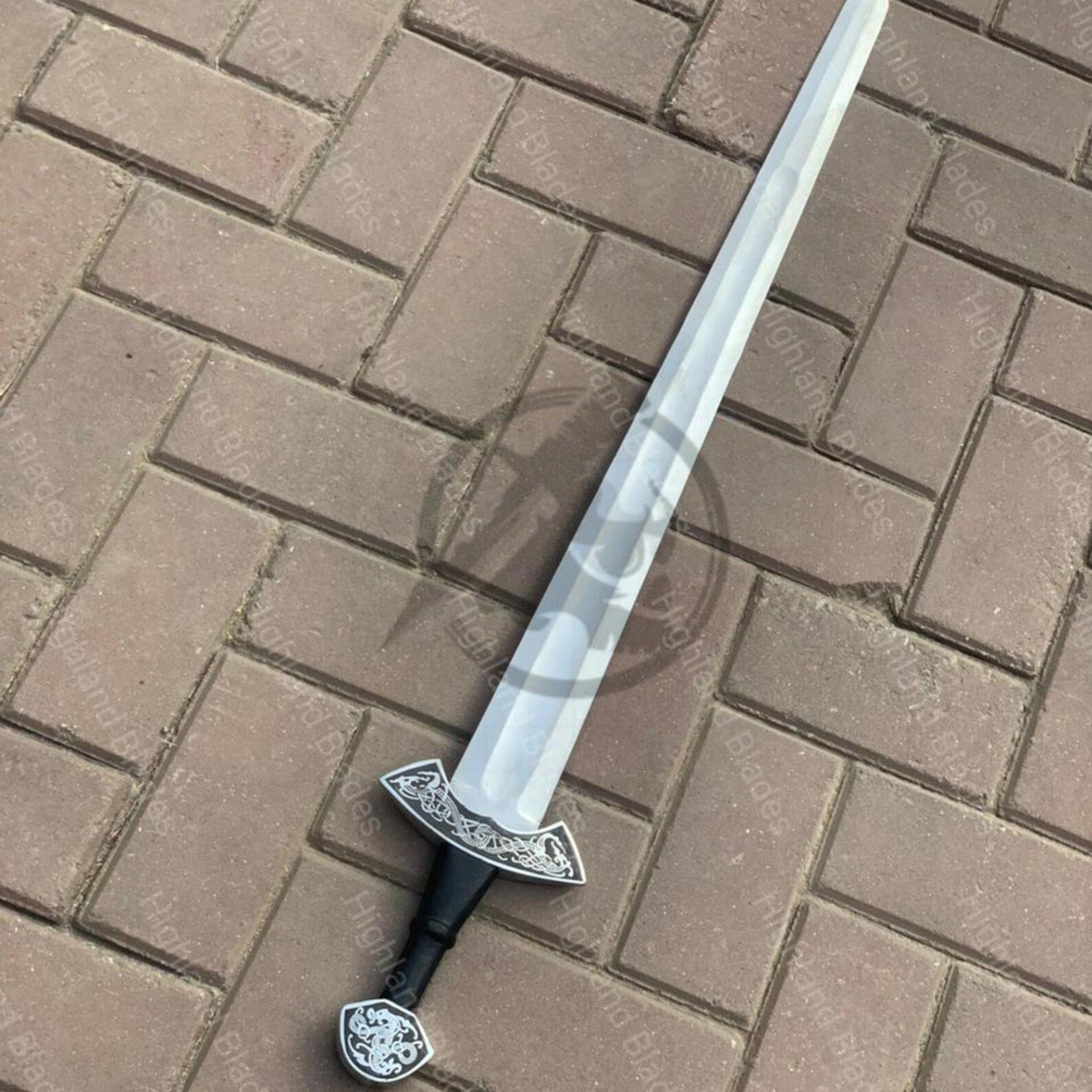 36in engraved medieval longsword with polished steel blade, black grip & ornate silver hilt