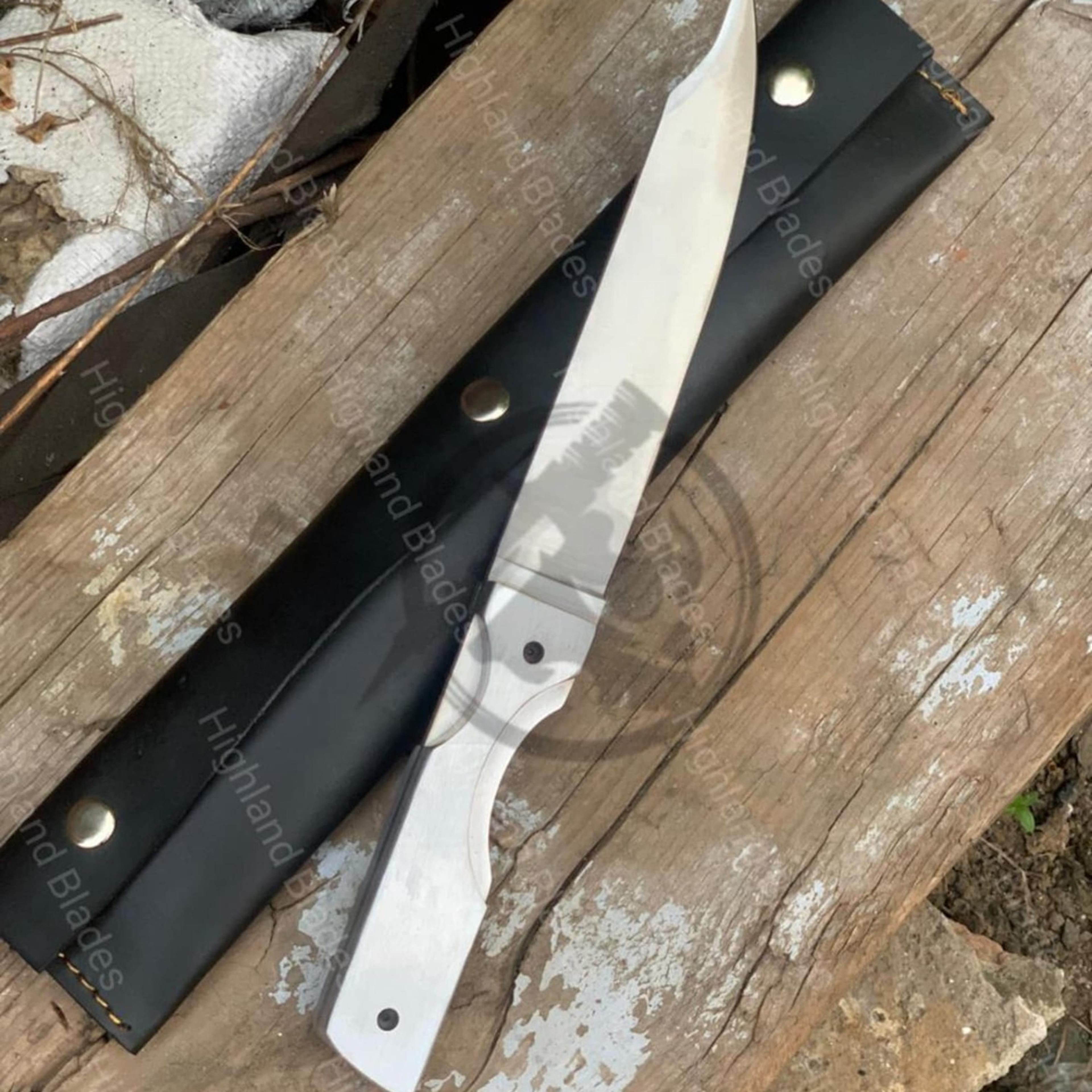 14in polished bowie knife with steel clip-point blade, white handle & black leather sheath