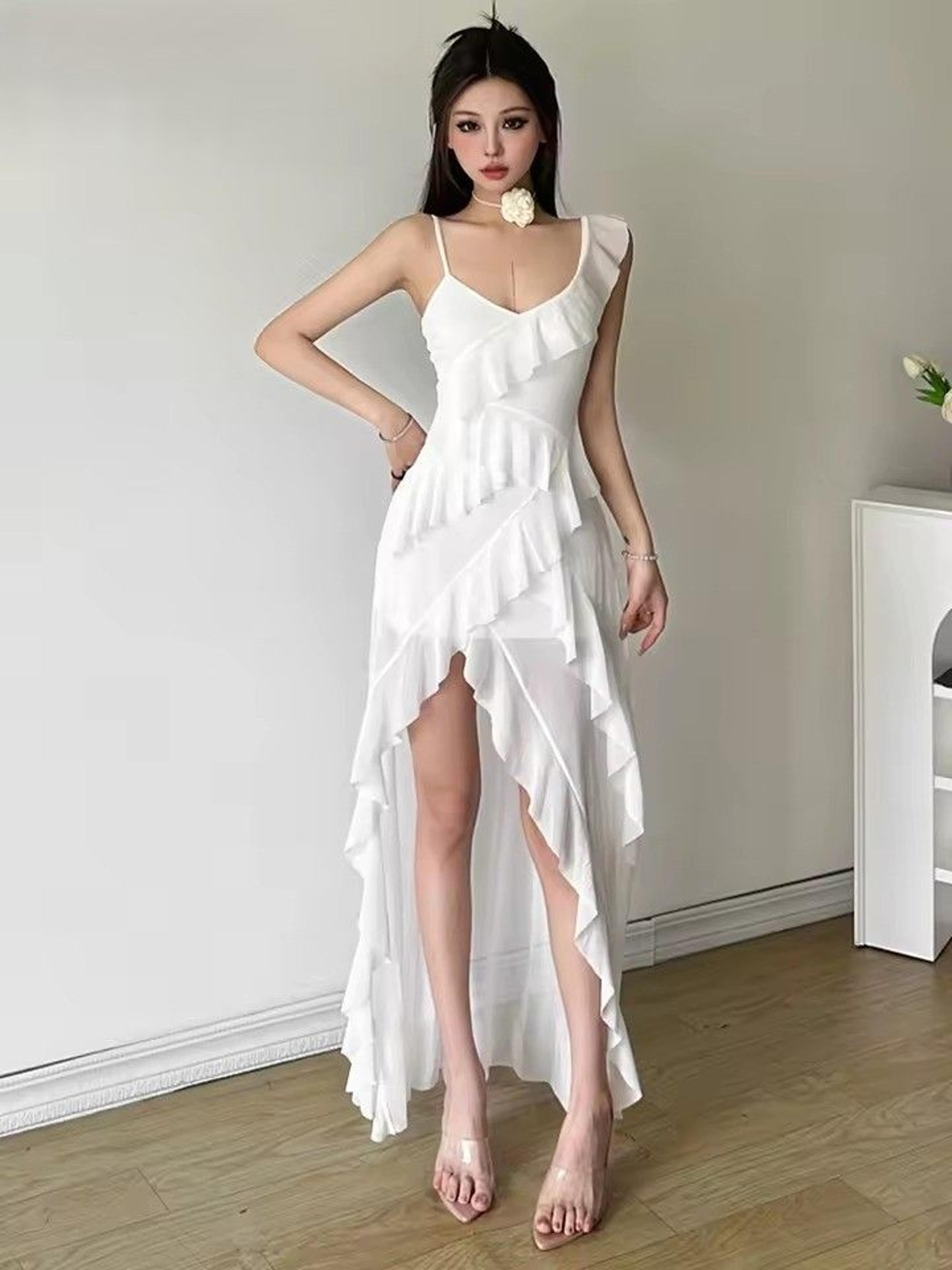 white ruffle maxi dress with tassel detail & elegant summer silhouette