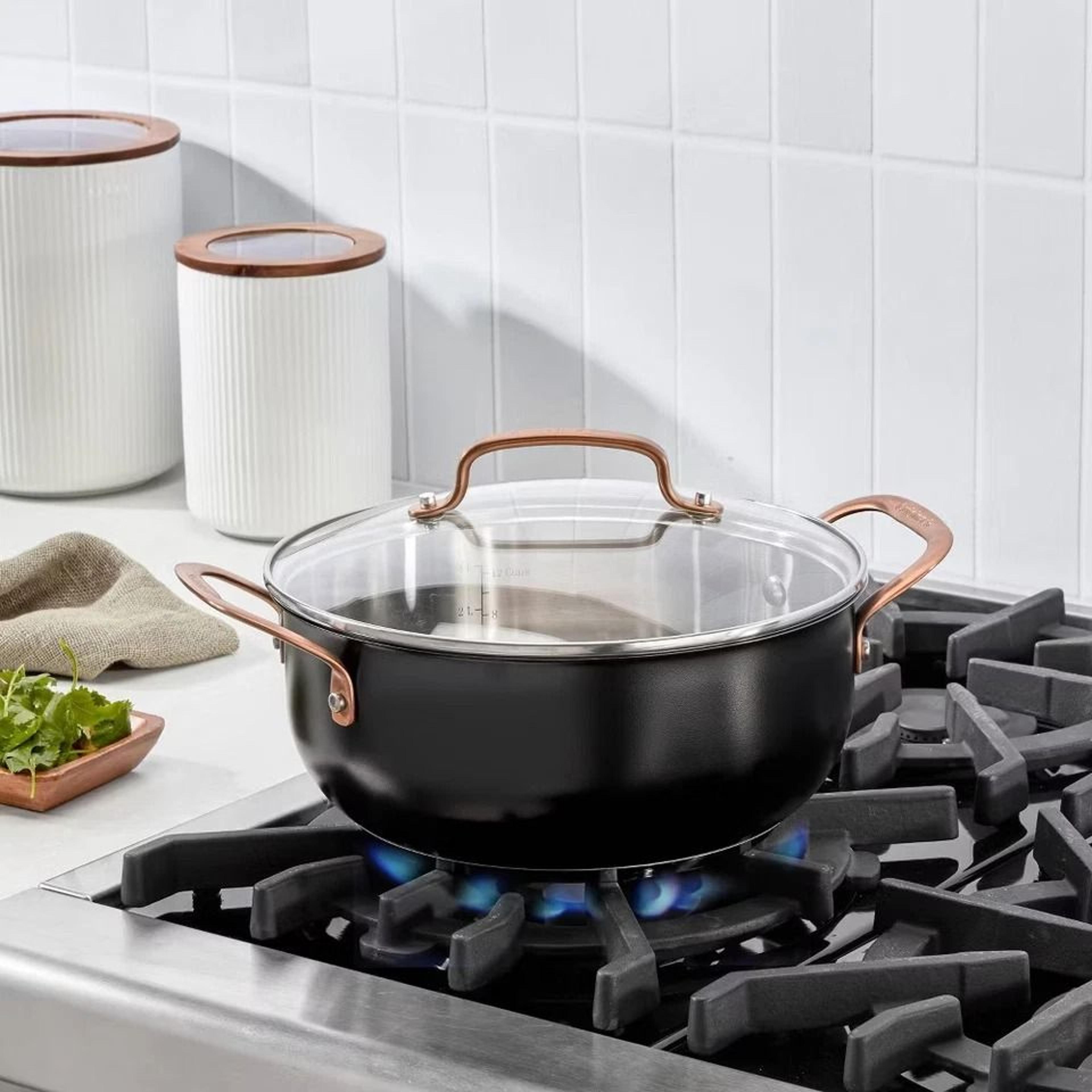 matte black stainless steel dutch oven with blush bronze lid, induction & oven safe, easy grip handles