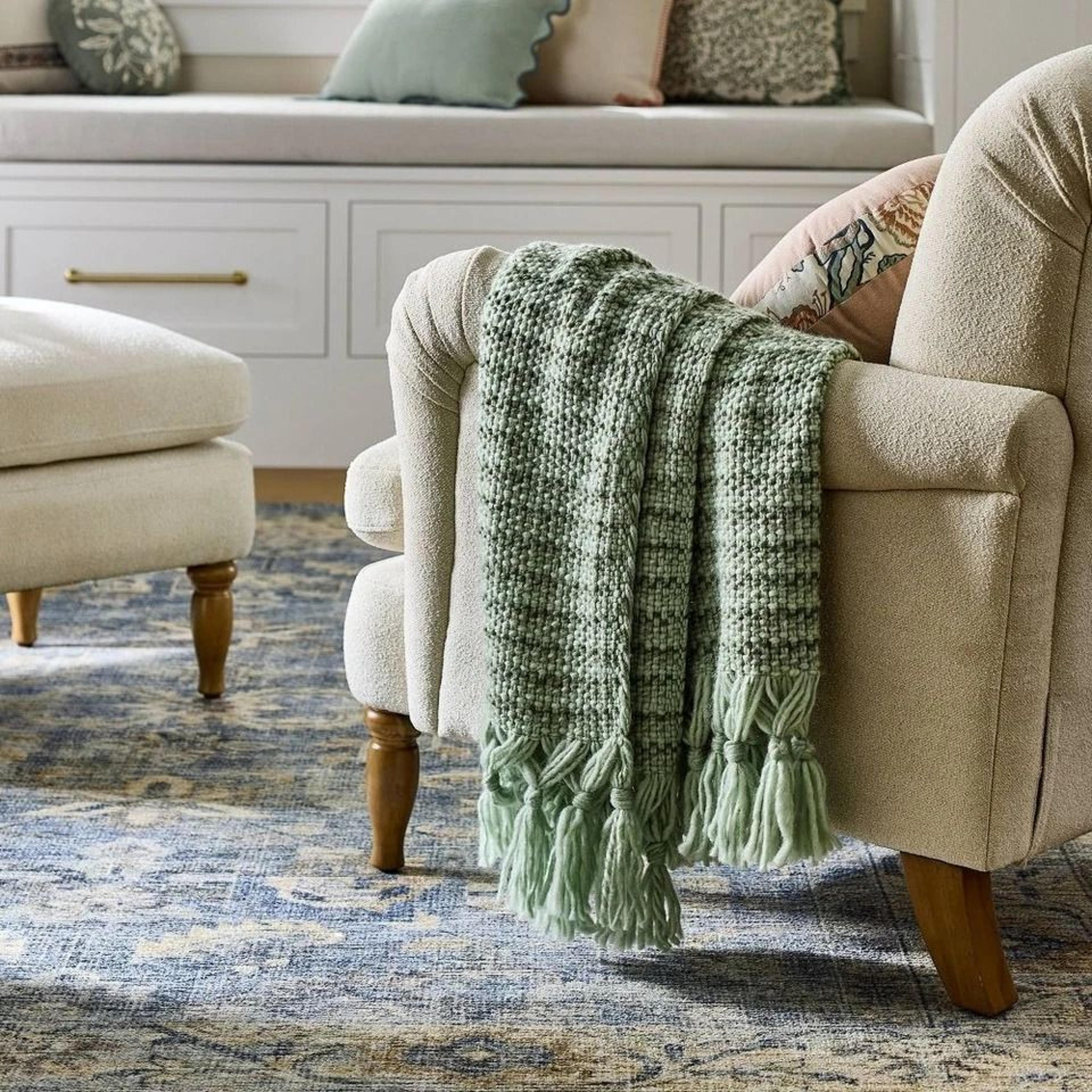 cozy multi green throw, mixed yarn woven with crossed tassels, recycled polyester for eco-conscious comfort