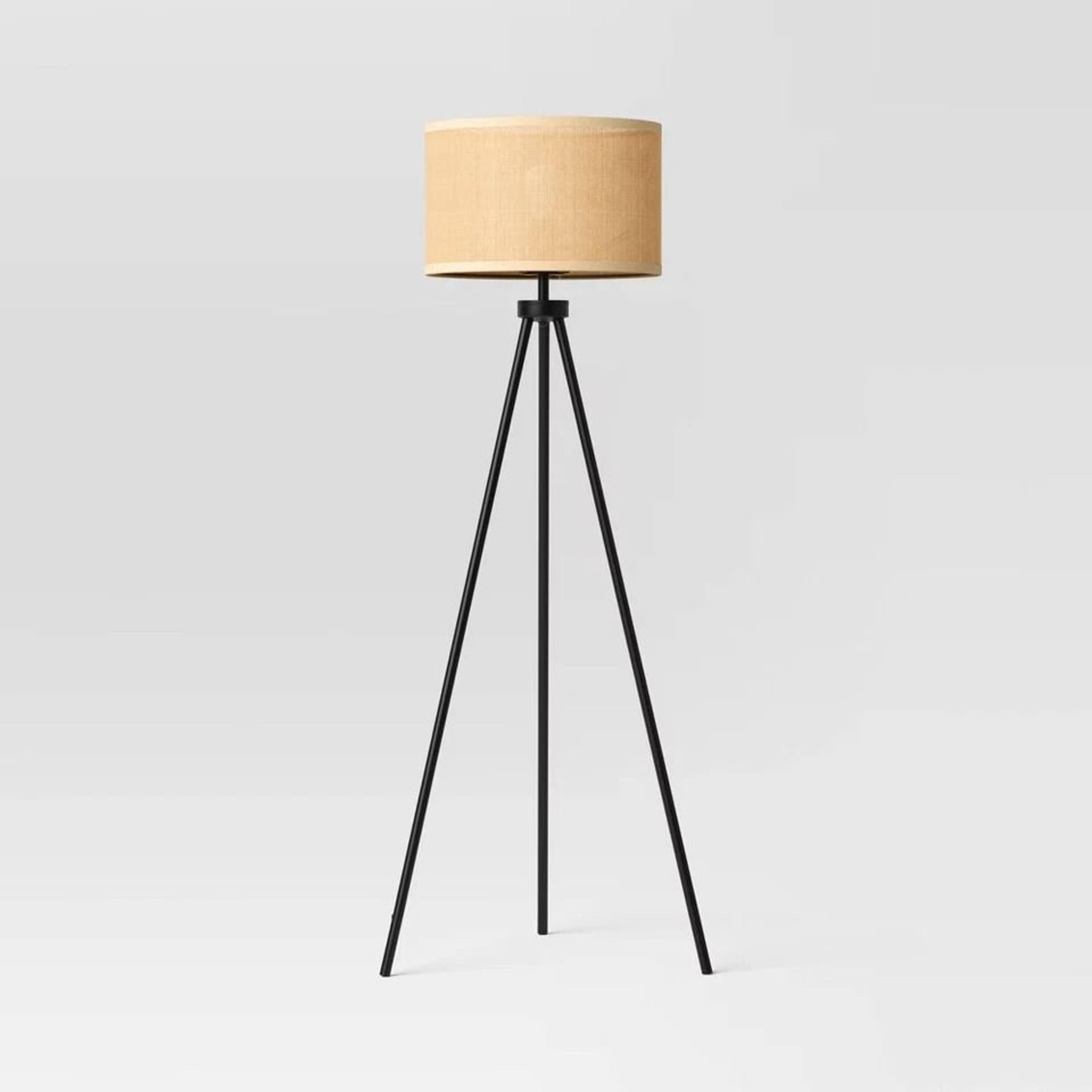 room essentials tripod floor lamp with oval paper shade, black metal body, adjustable height