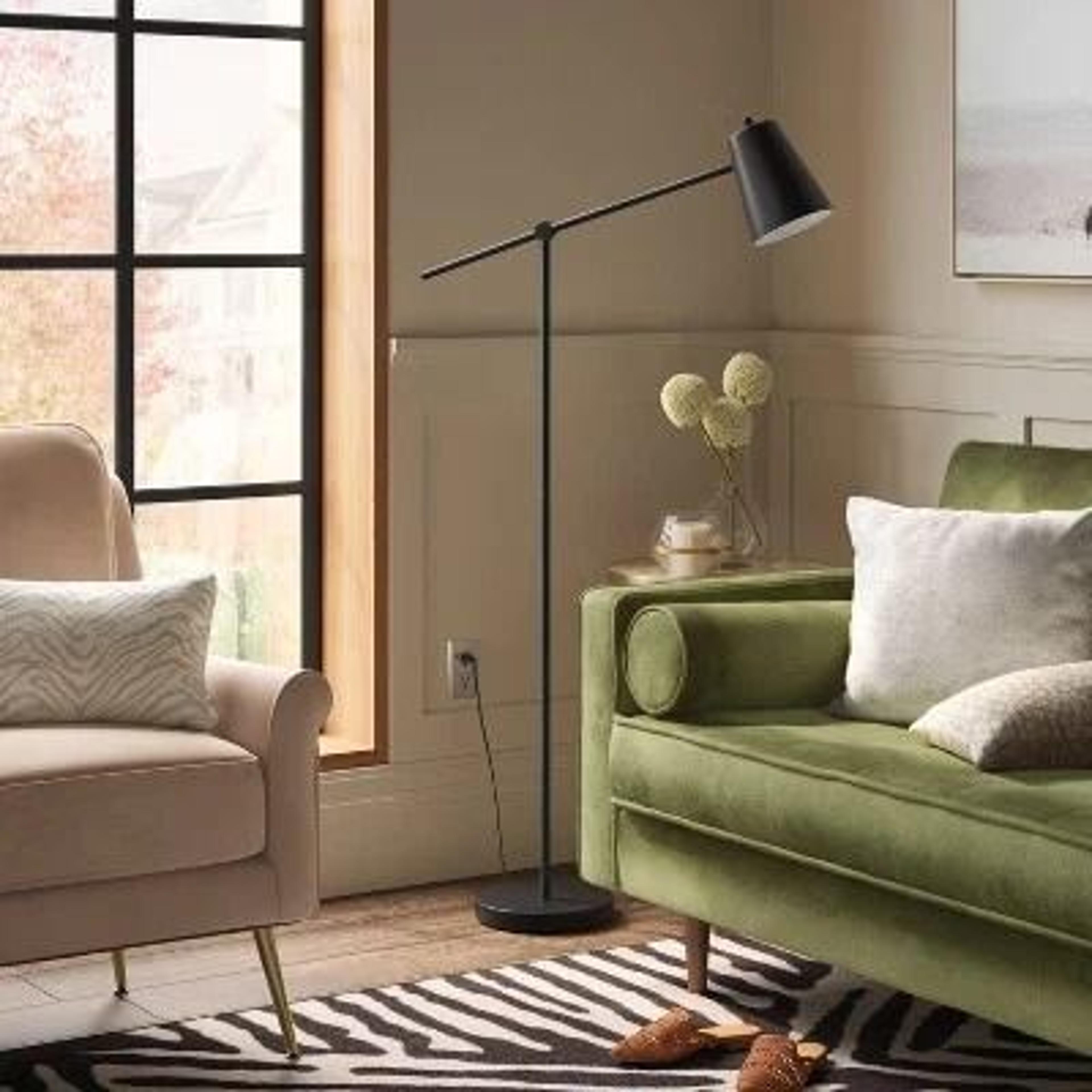black floor lamp with adjustable arm, swivel shade, metal base, perfect for desk or living room