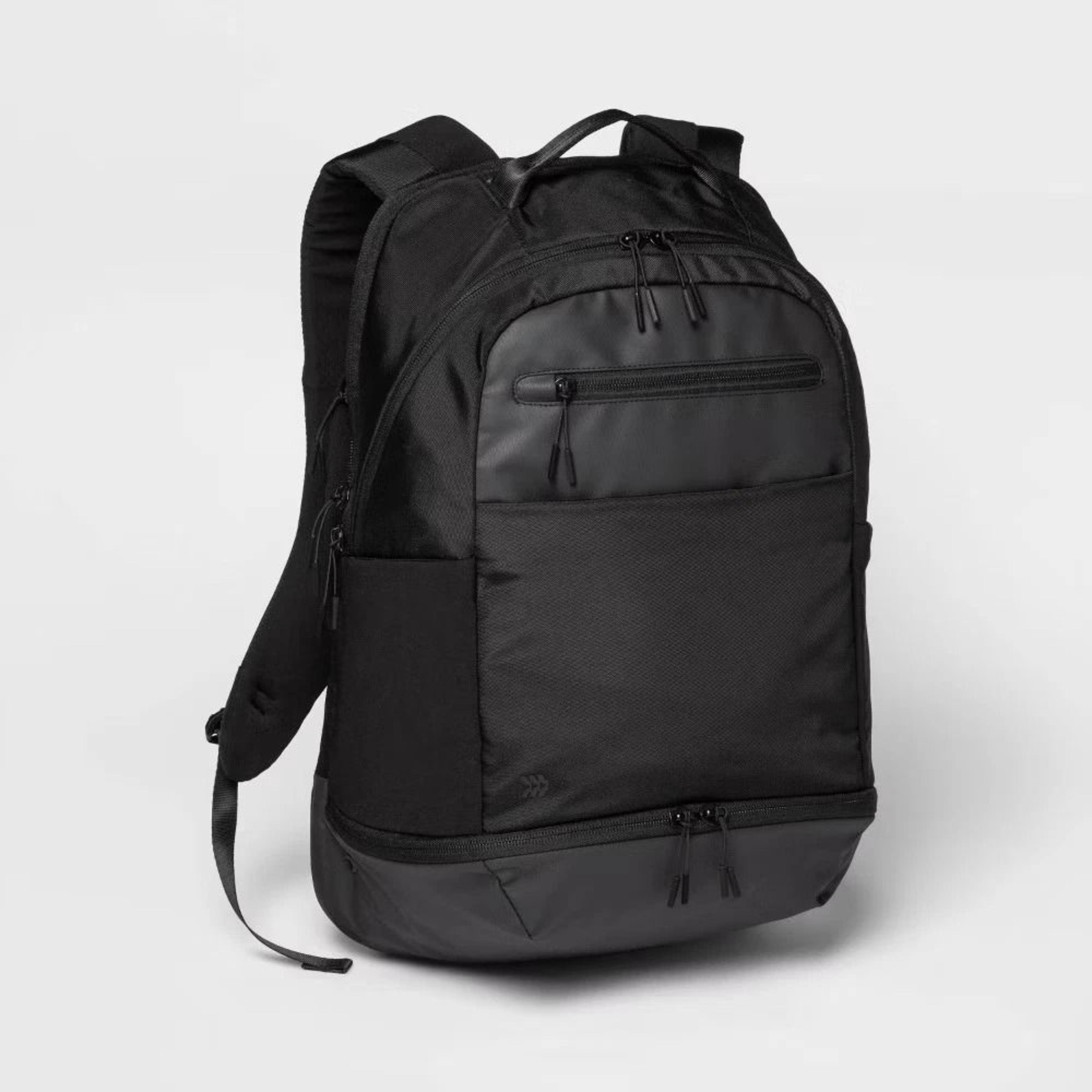 all in motion black backpack, lightweight polyester, adjustable straps, travel bag, commuter backpack