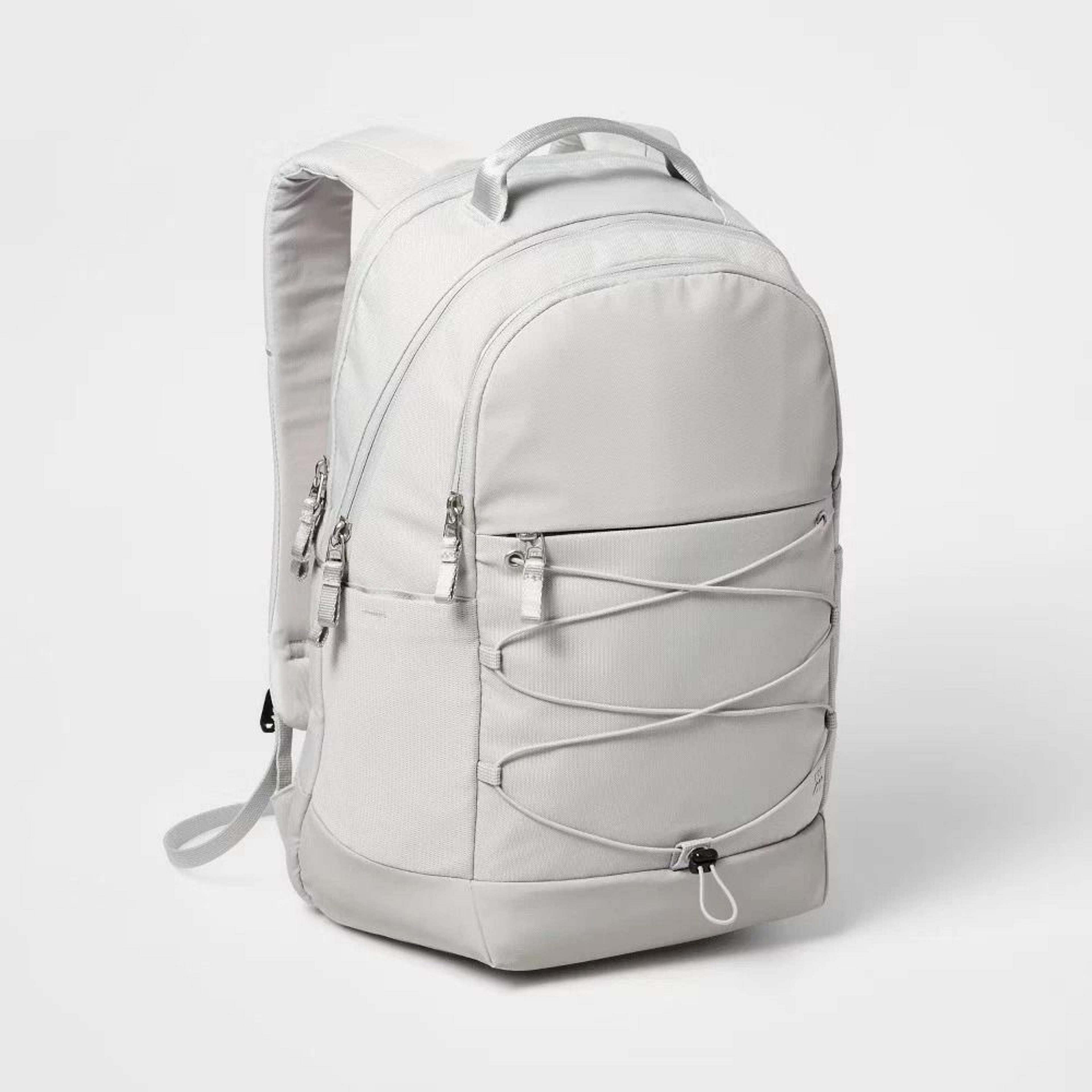 all in motion silver backpack, durable school laptop bag, stain-resistant, spacious carrying bag