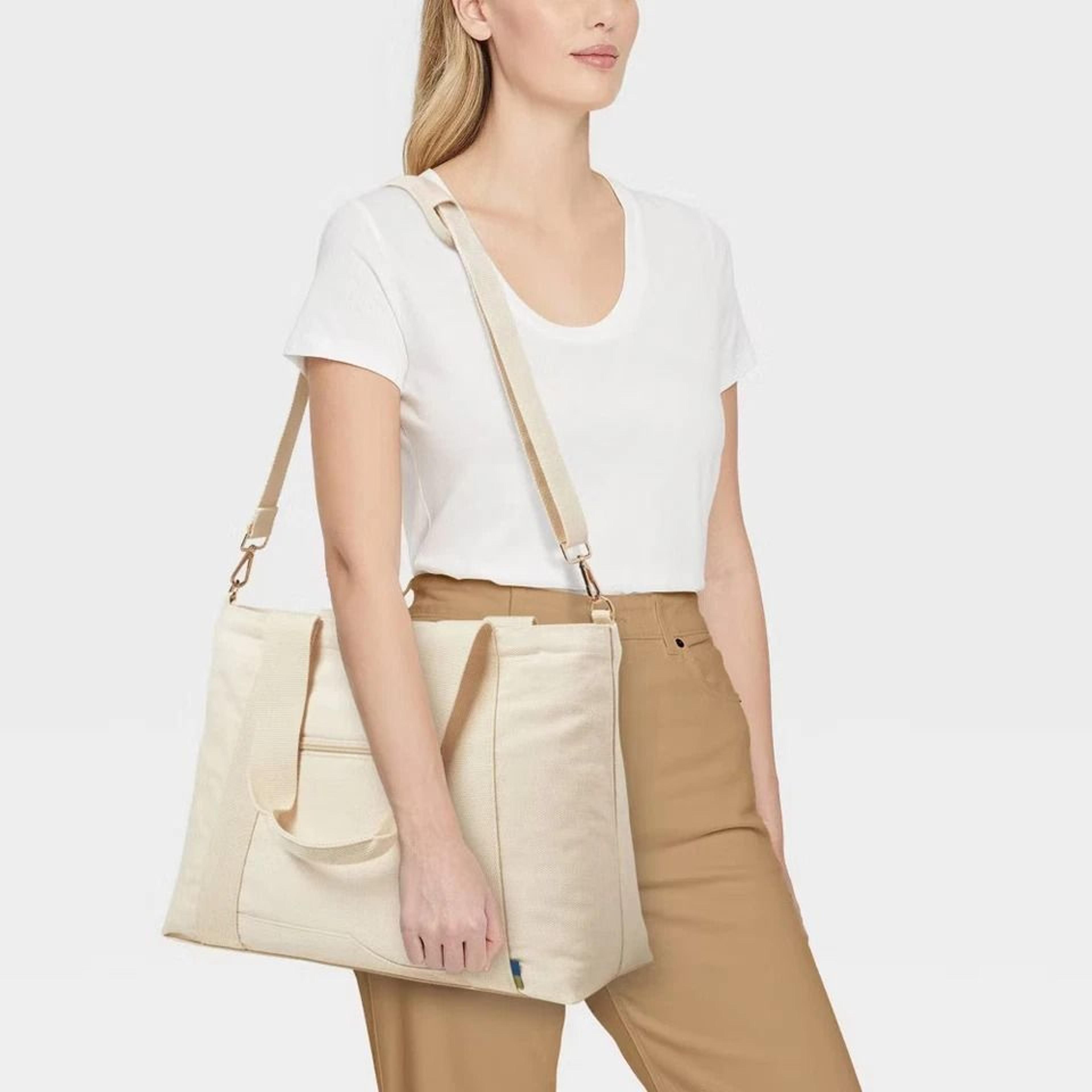 open story solid canvas school tote bag, rfid blocking, water-resistant, padded laptop compartment, adjustable straps