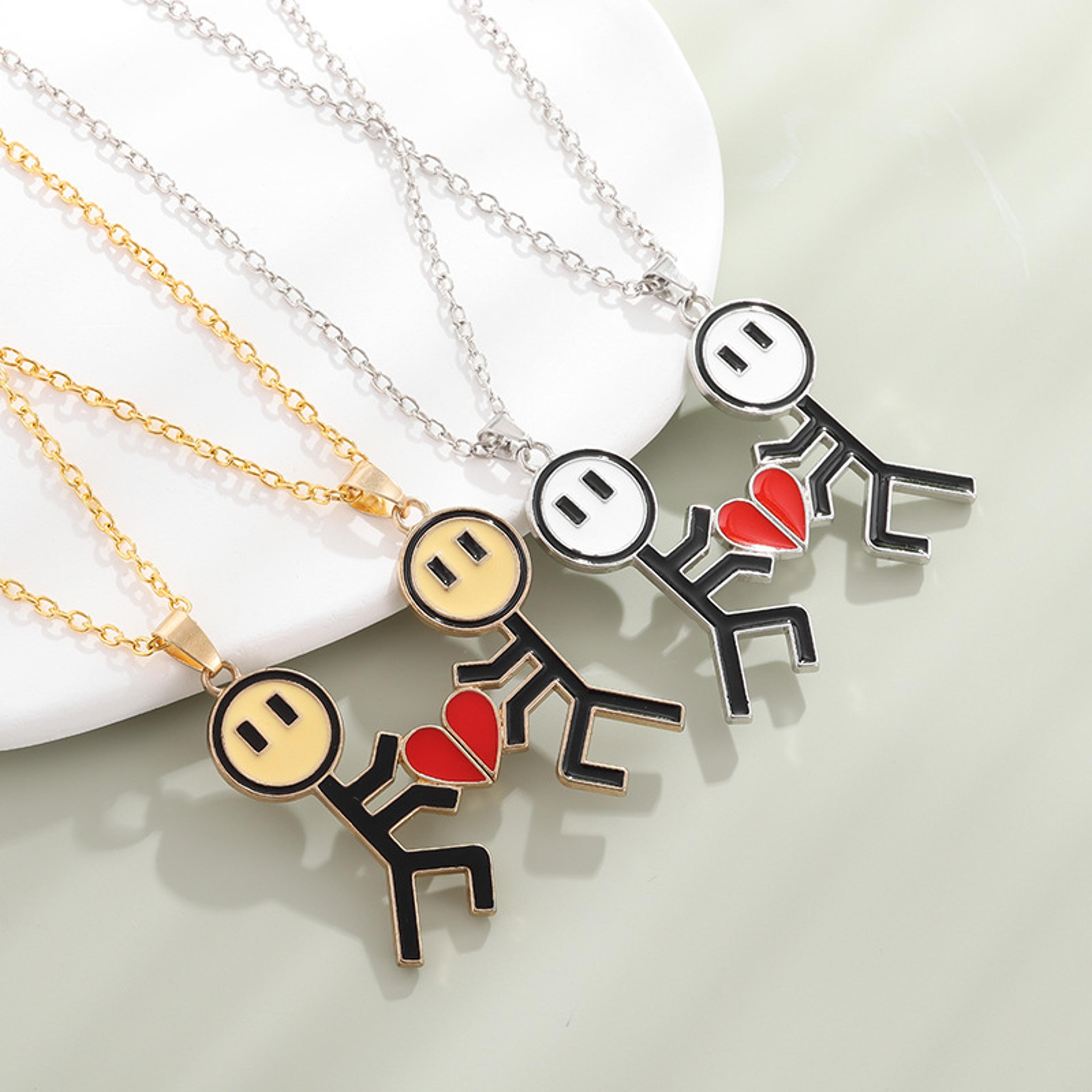 magnetic couple necklace with stickman charm and heart pendant