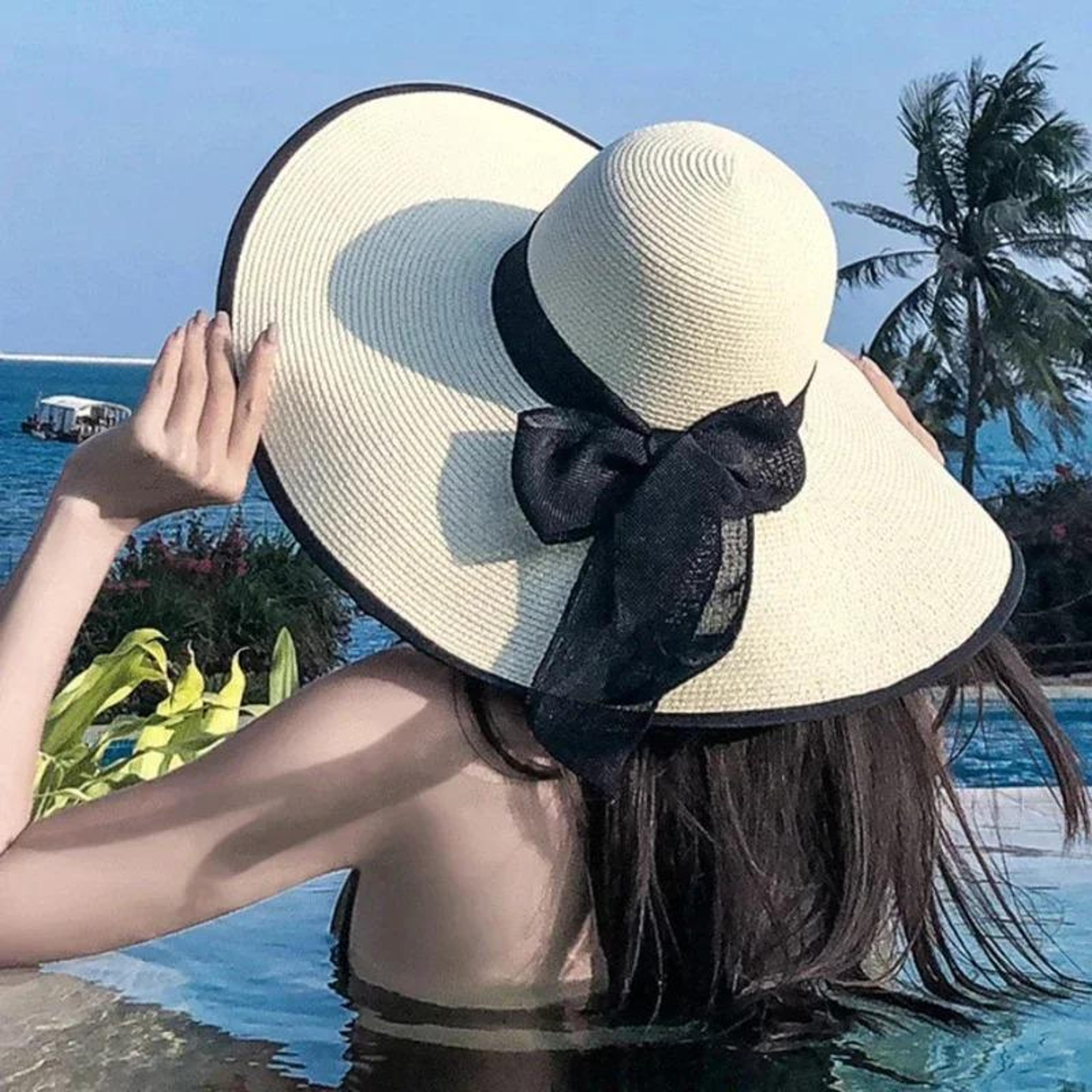 legant wide brim straw hat with black bow – chic flat top summer sun hat & lightweight beach panama cap