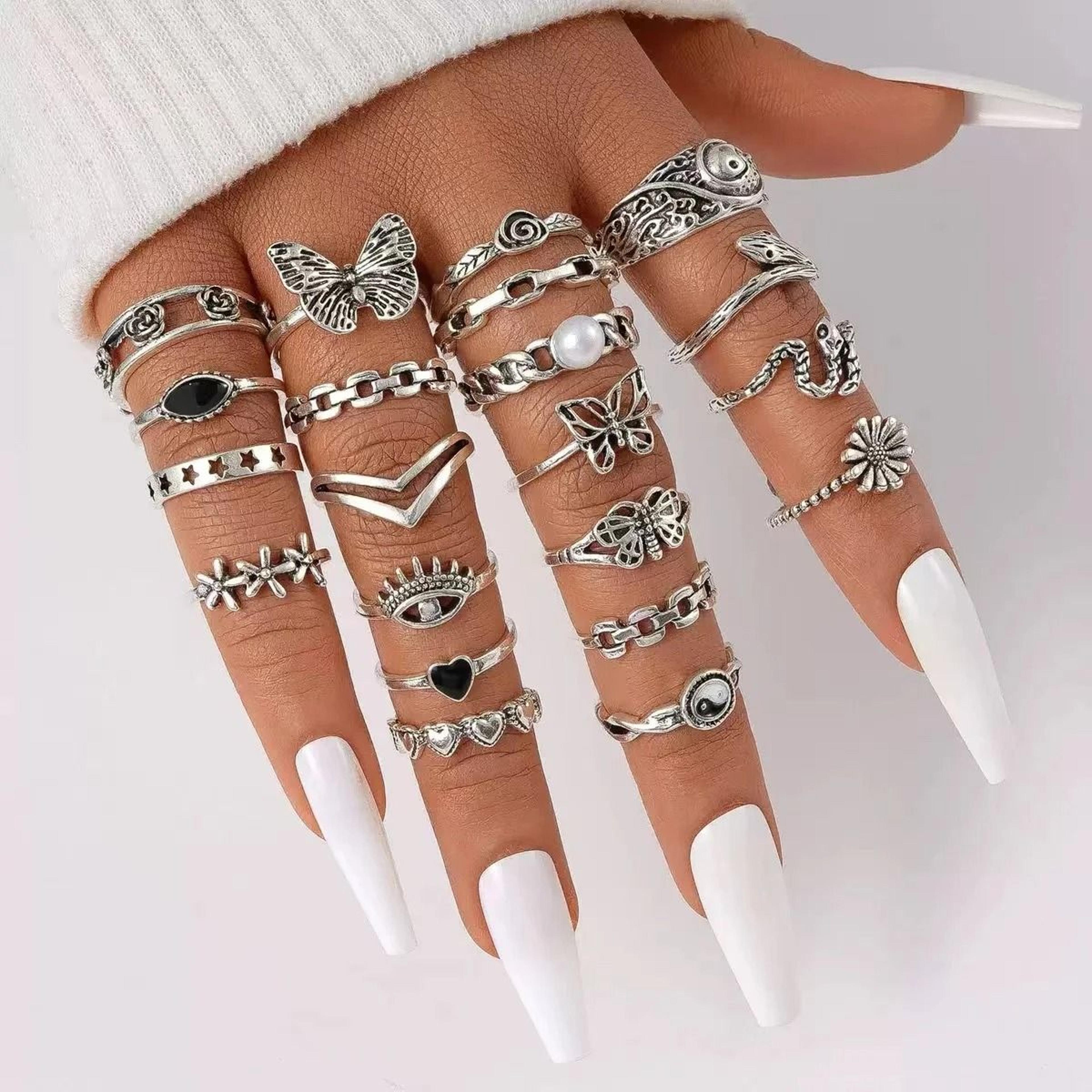 punk style multi element ring set with butterfly heart and tai chi designs