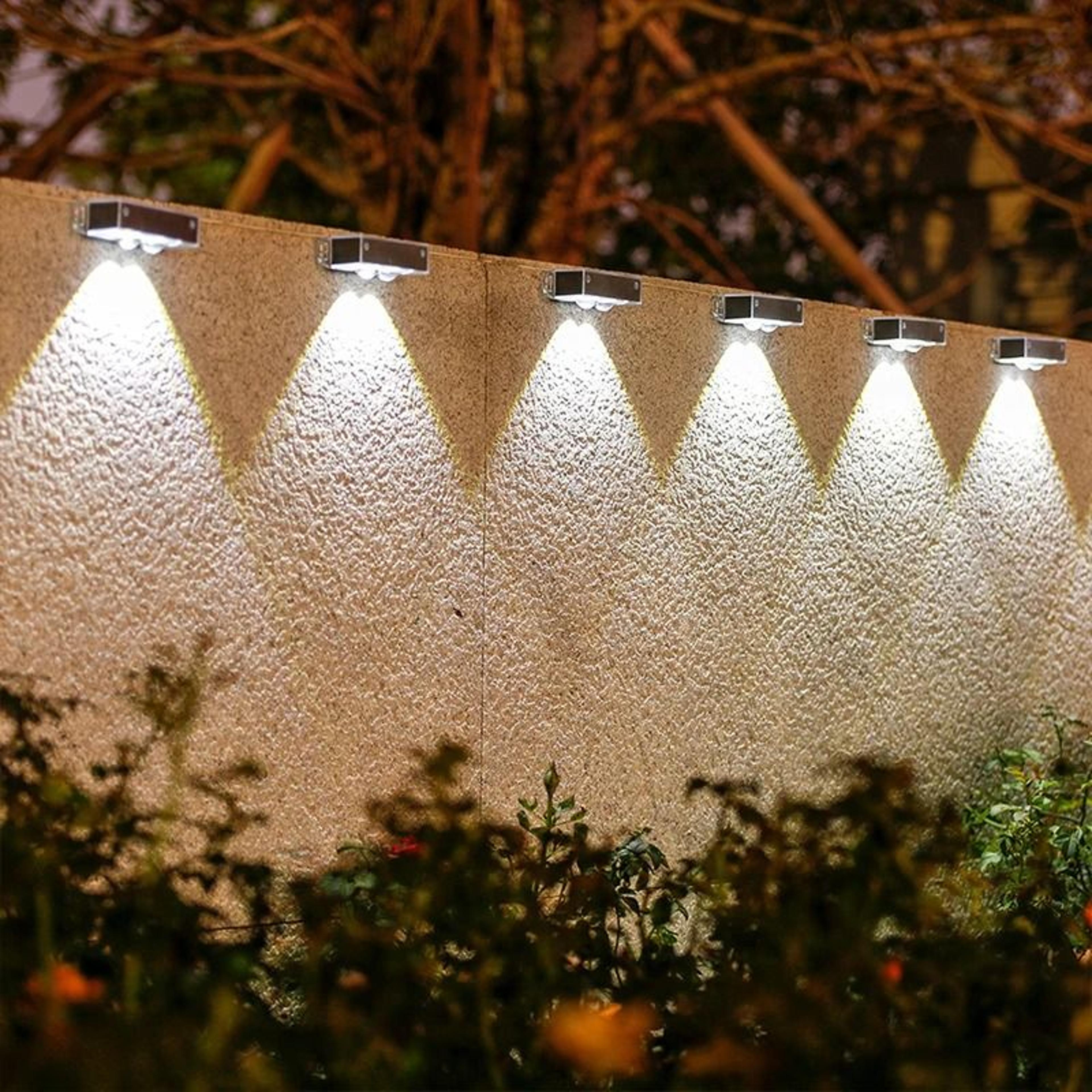 4 pack solar wall lamps with smart sensor auto on off for garden fence and pathway lighting