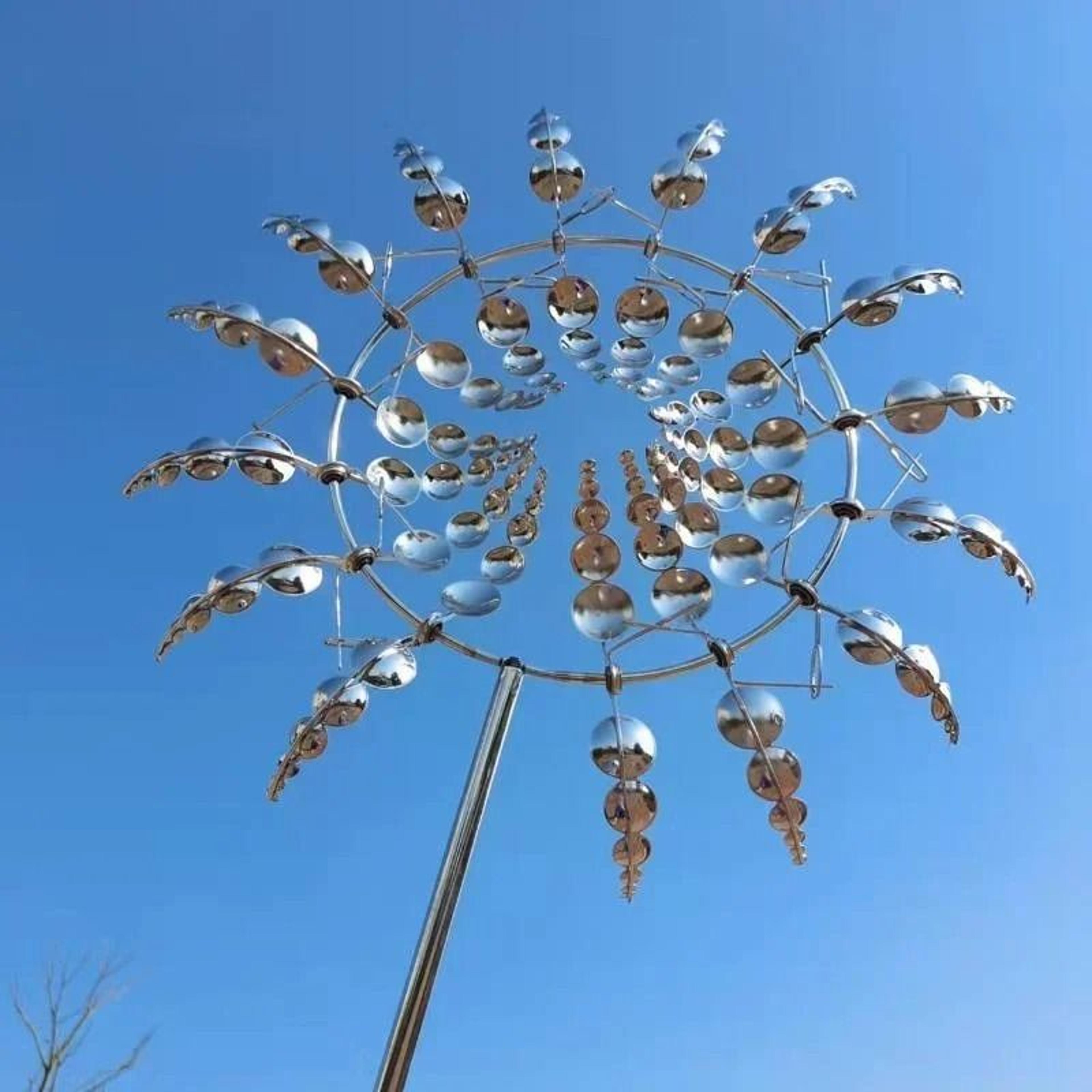 modern silver kinetic metal wind spinner