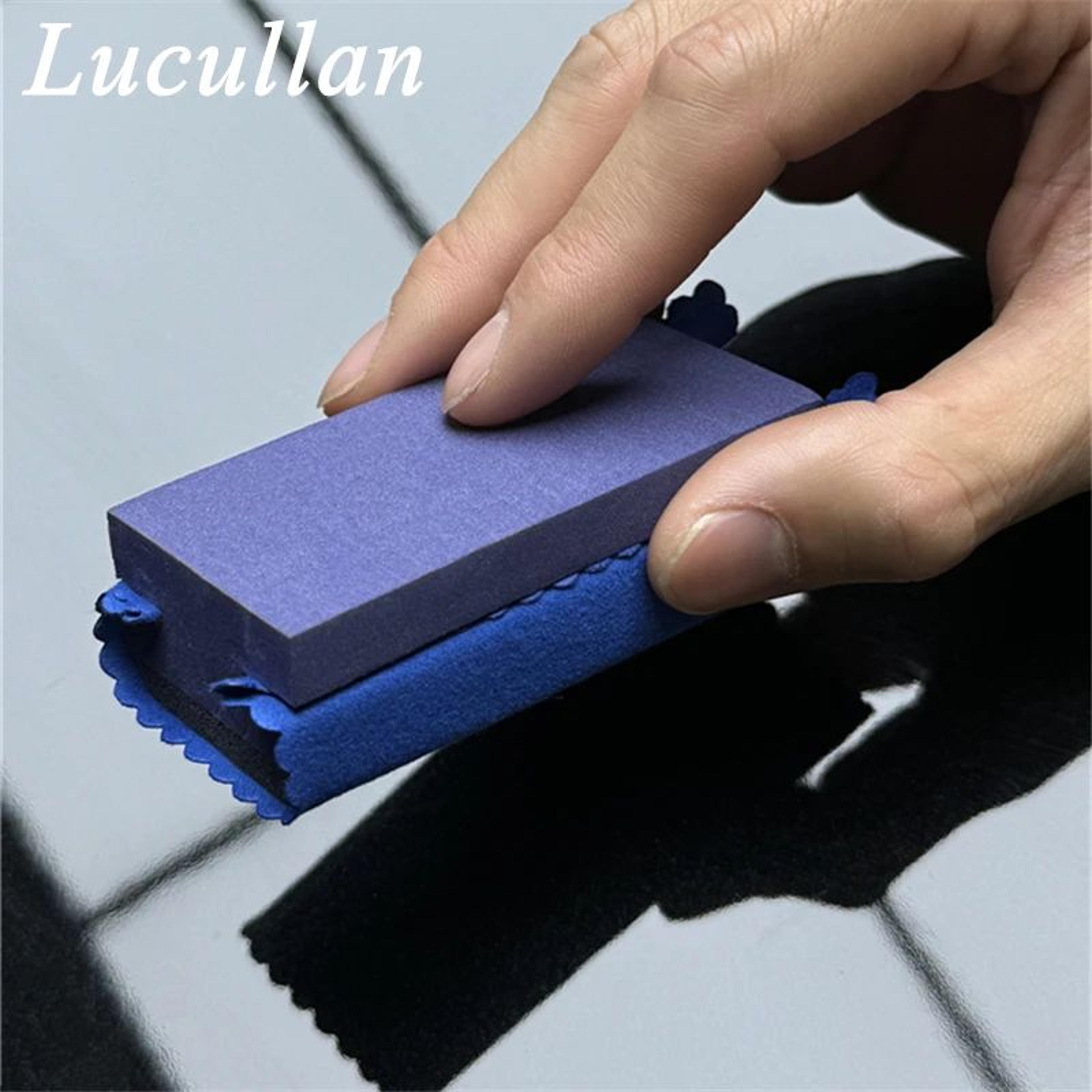 ceramic coating applicator kit with purple sponge and dark blue suede cloths