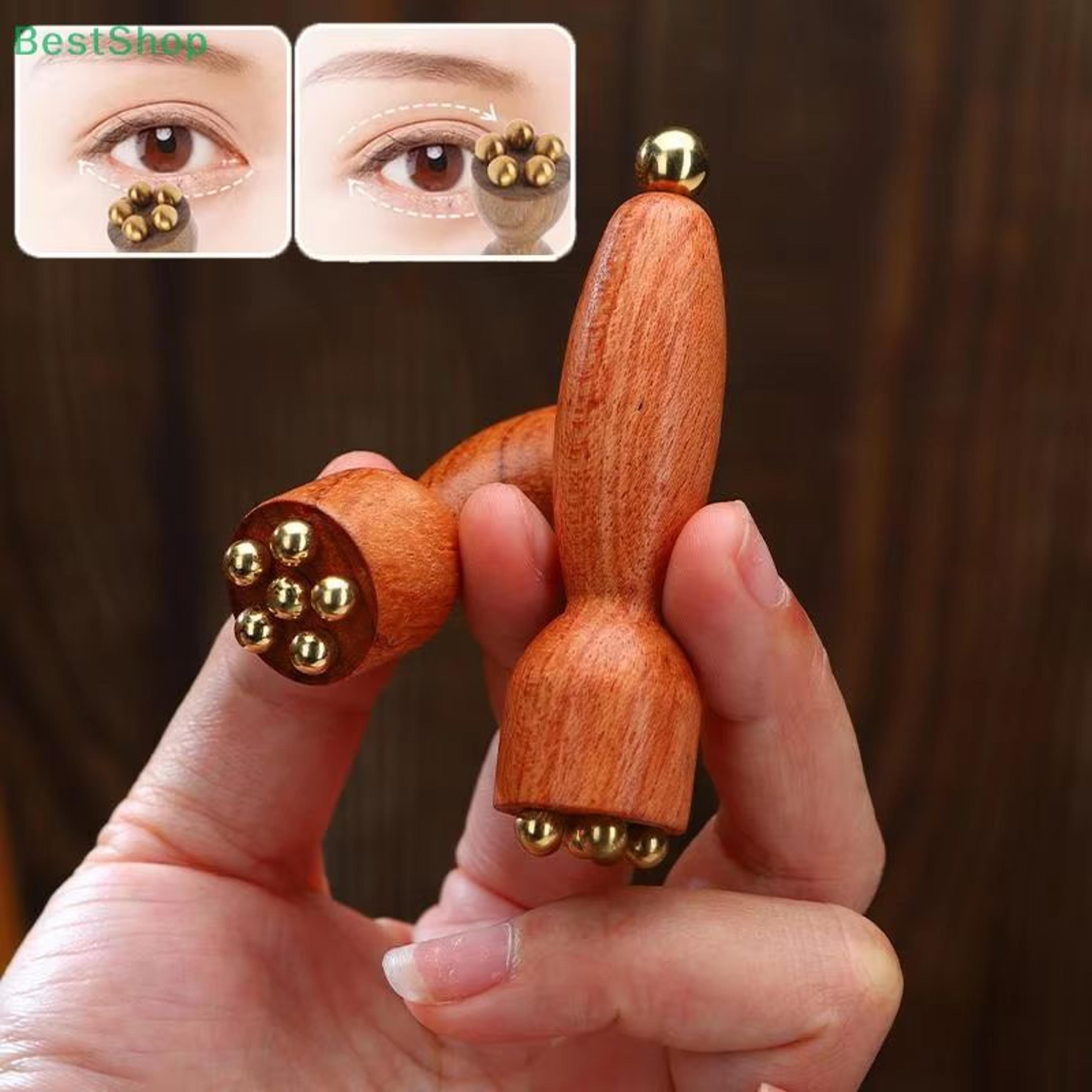 lotus seedpod brass and rosewood facial gua sha tool for eye relaxation and meridian massage