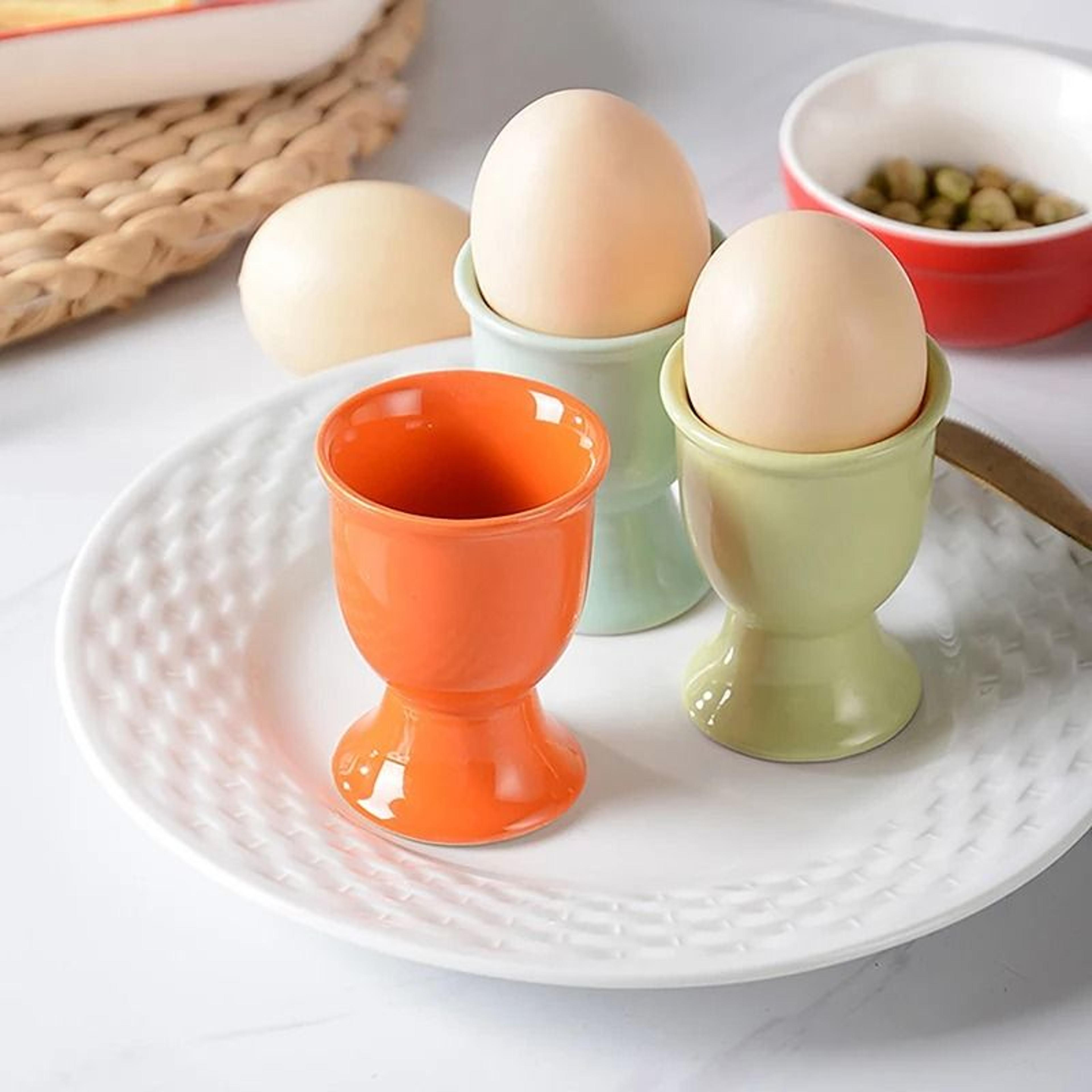 ceramic egg cup holders in candy colors for stylish kitchen serving
