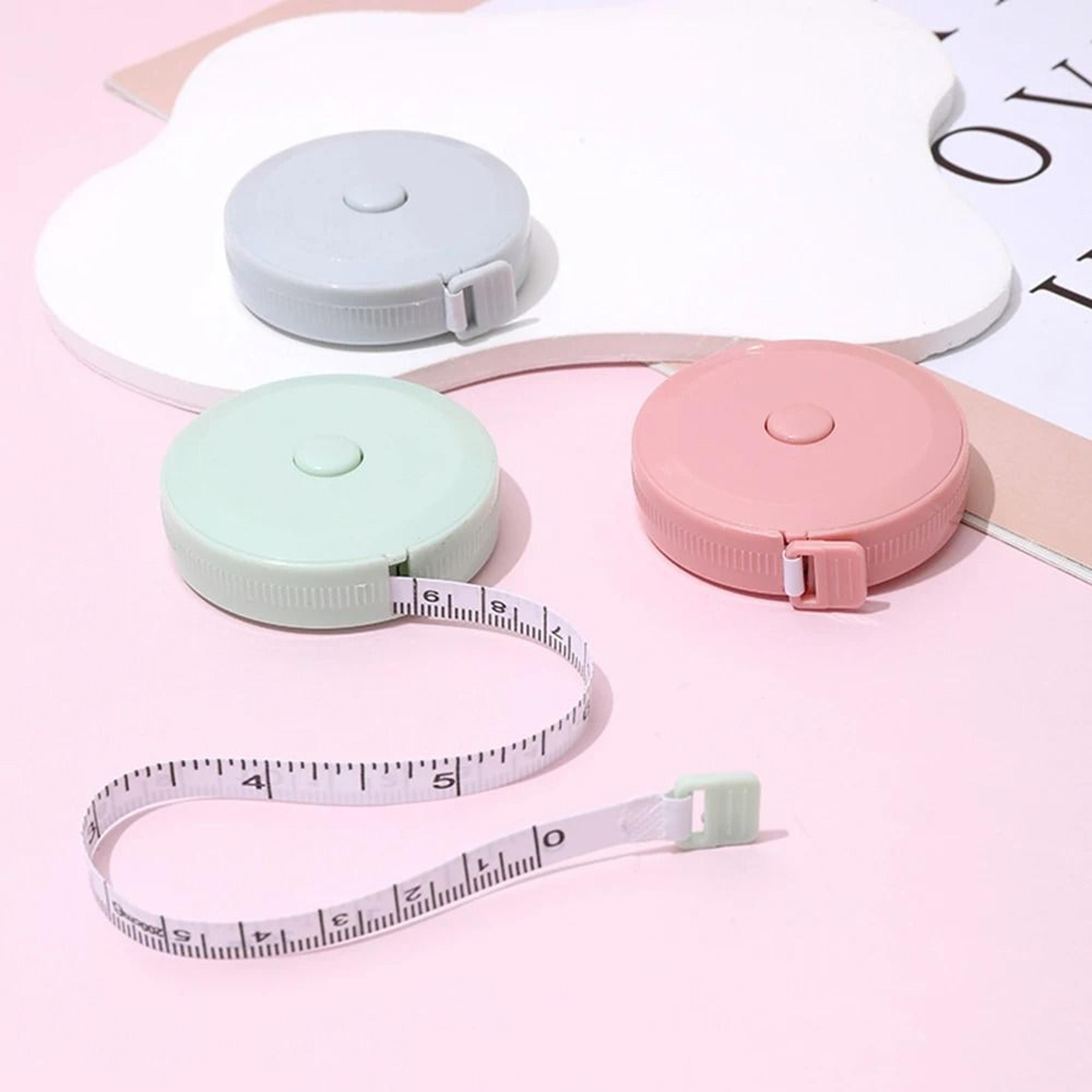 small soft tape measure with automatic retraction for sewing and clothes measurement