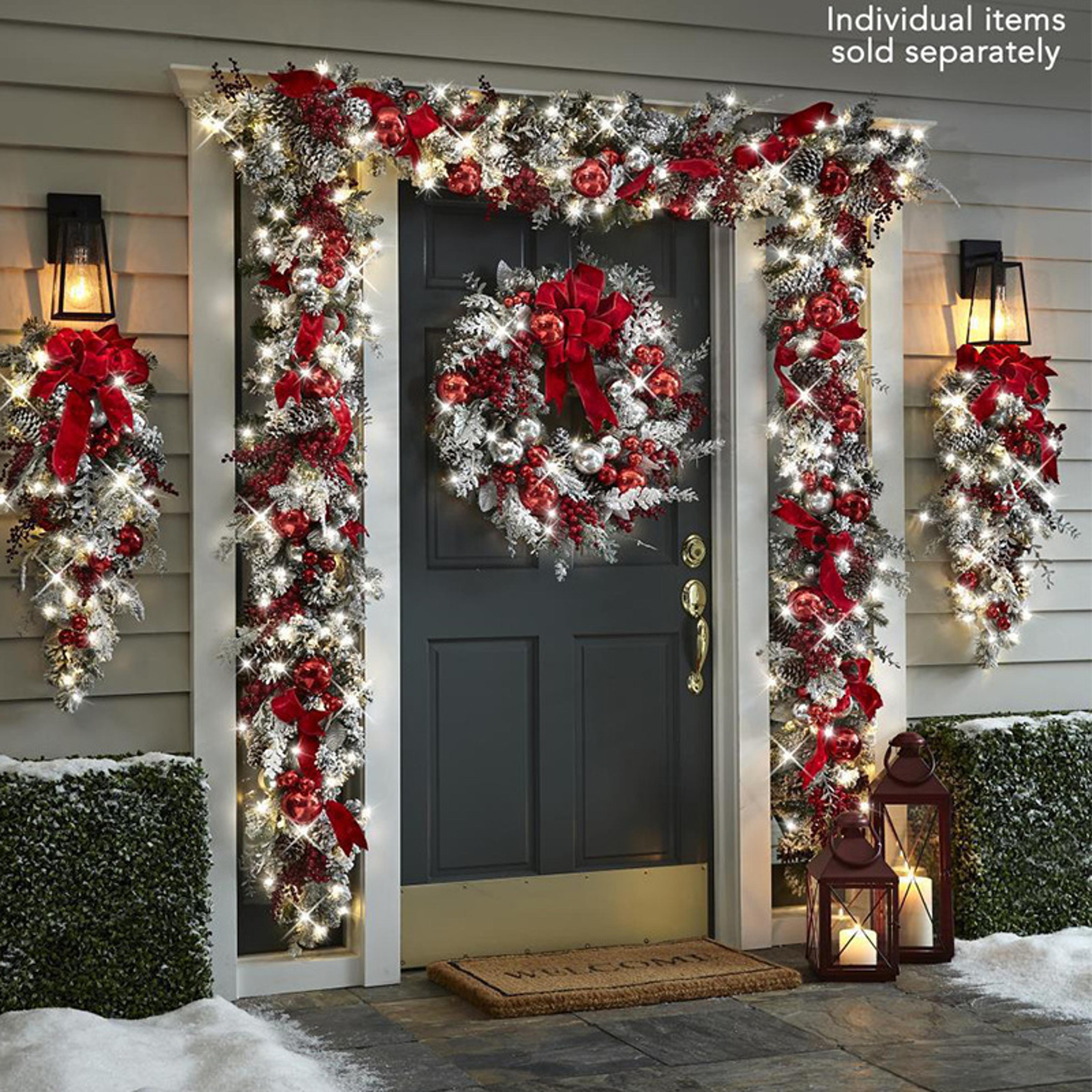 christmas wreath and garland door decor for a warm, festive holiday welcome