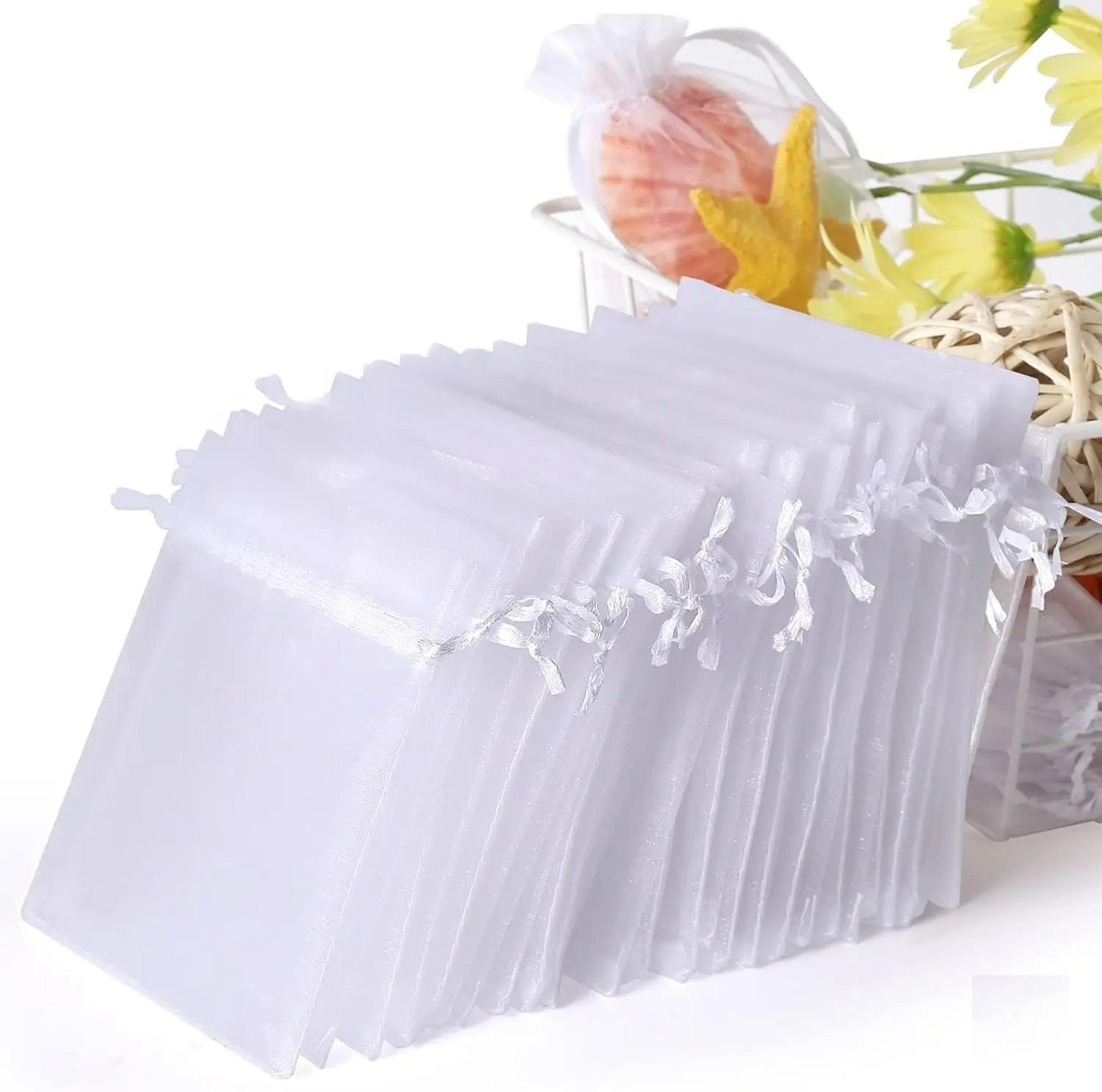 white organza gift bags for party favors and jewelry packaging