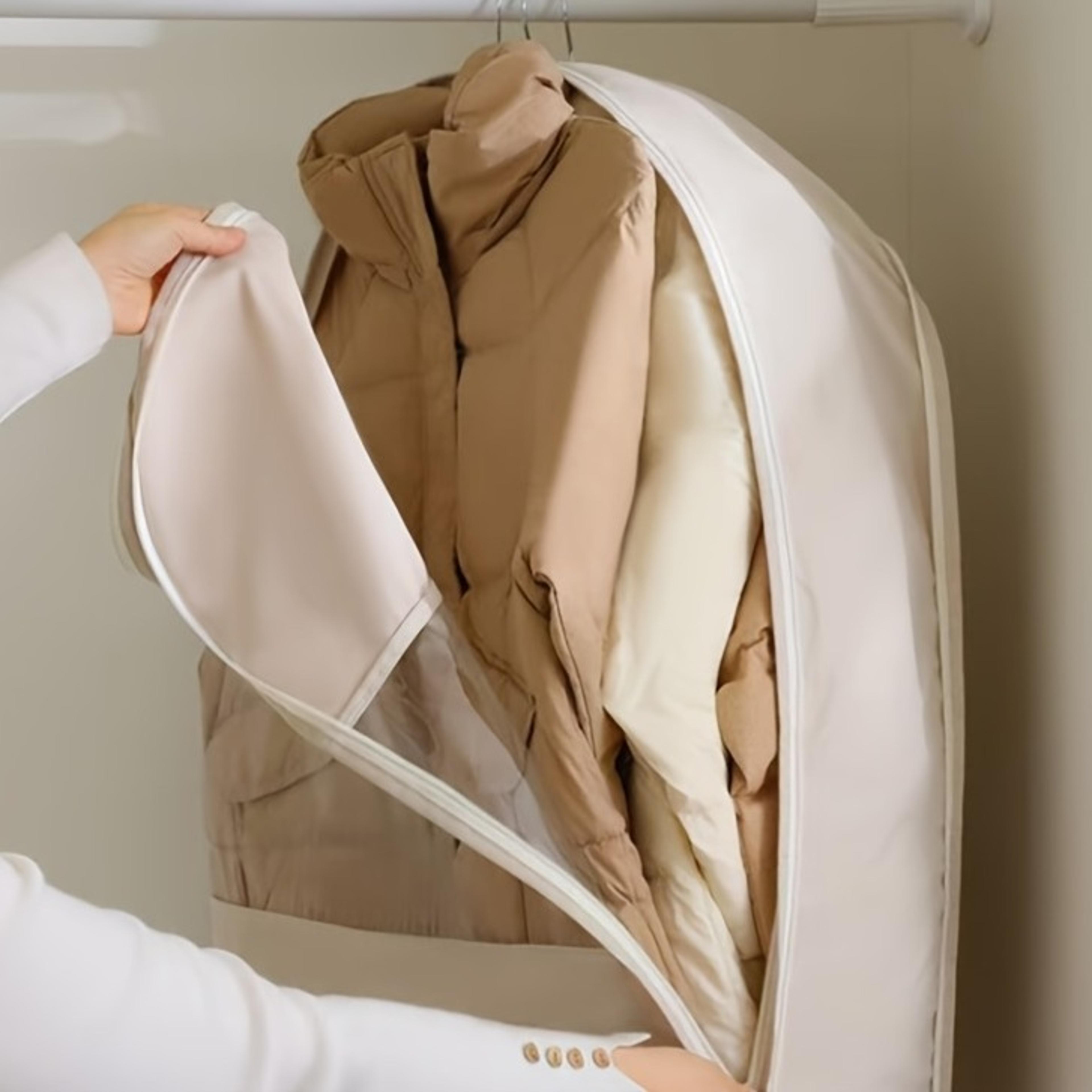beige hanging vacuum storage bags with compression seal for space saving wardrobe organization