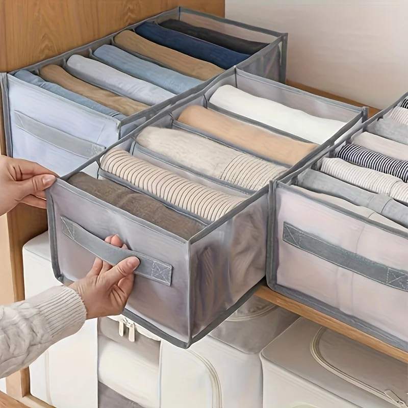 Foldable wardrobe organizer set with assorted boxes holding folded clothes in a closet