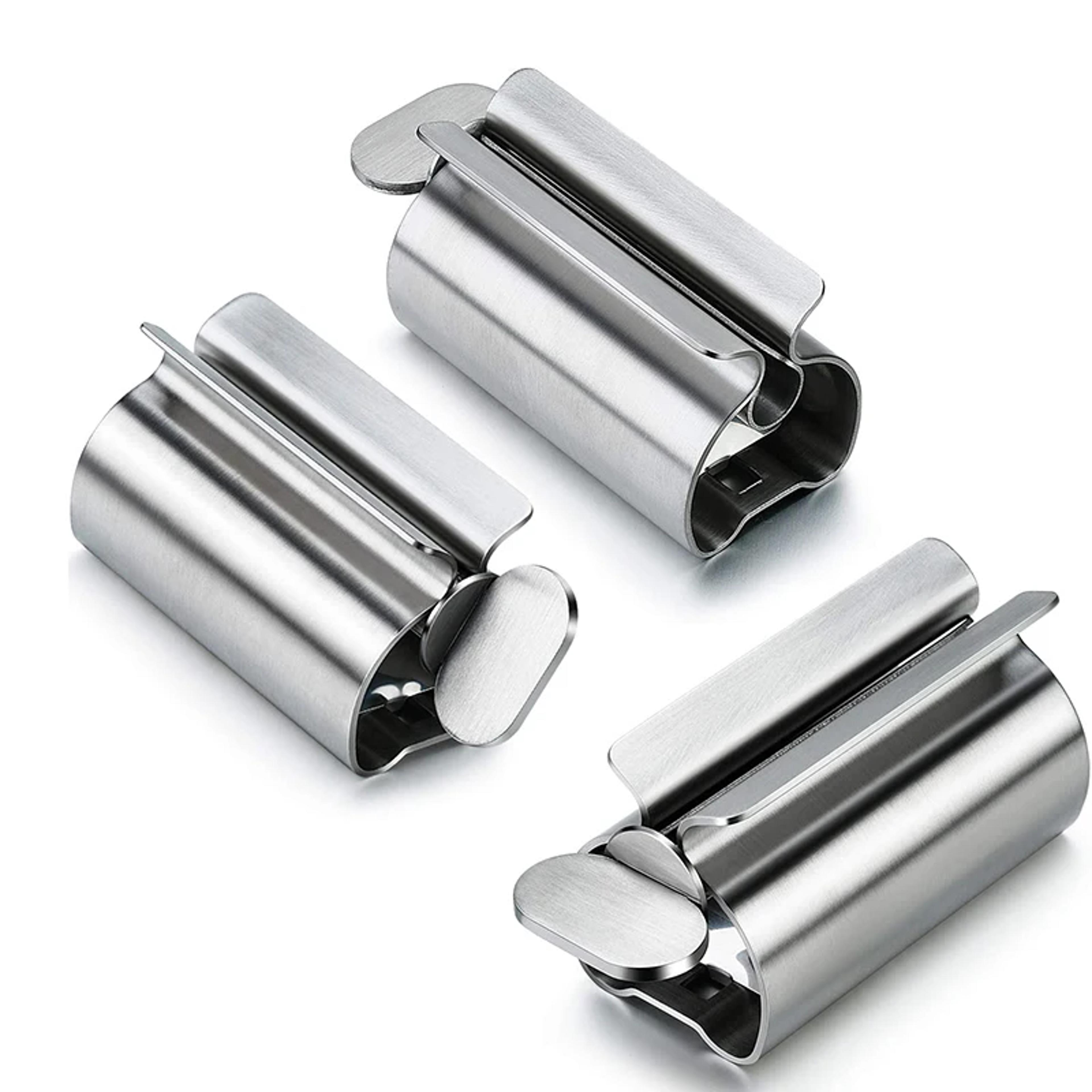 stainless steel toothpaste dispenser with bathroom storage rack and rolling tube squeezer