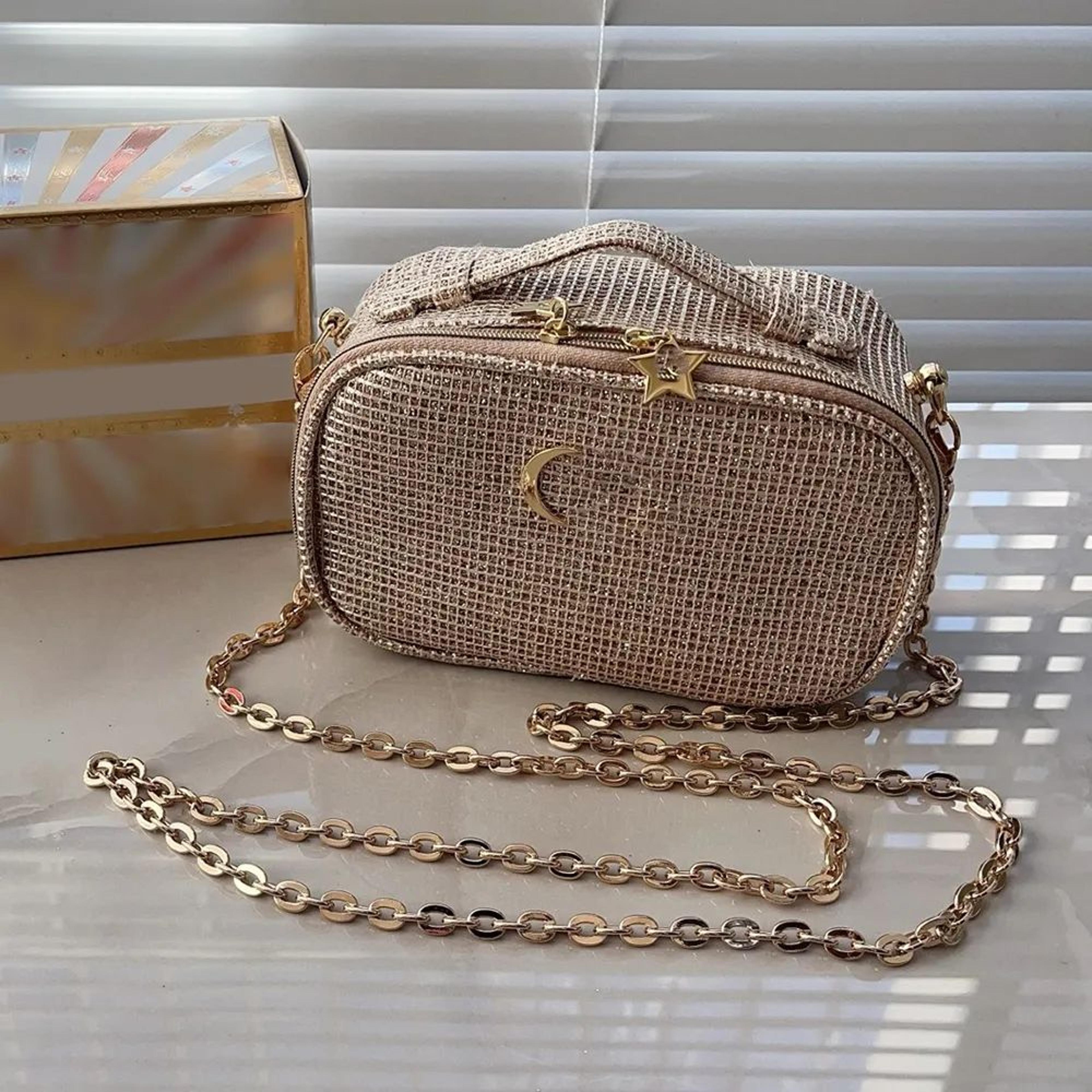 cosmetic makeup bag organizer with gold chain and zipper for travel