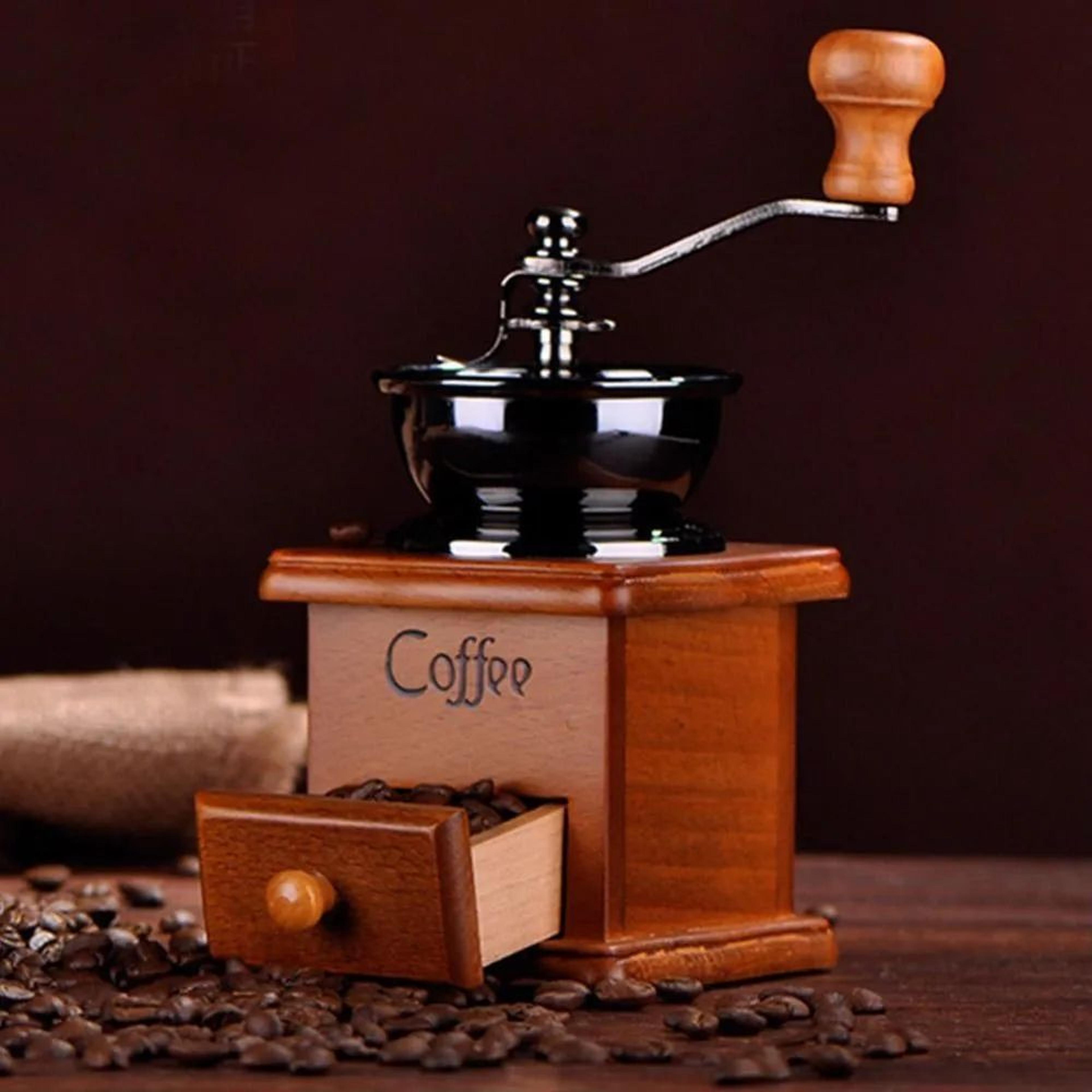 manual coffee grinder with wooden body and ceramic grinding core retro style