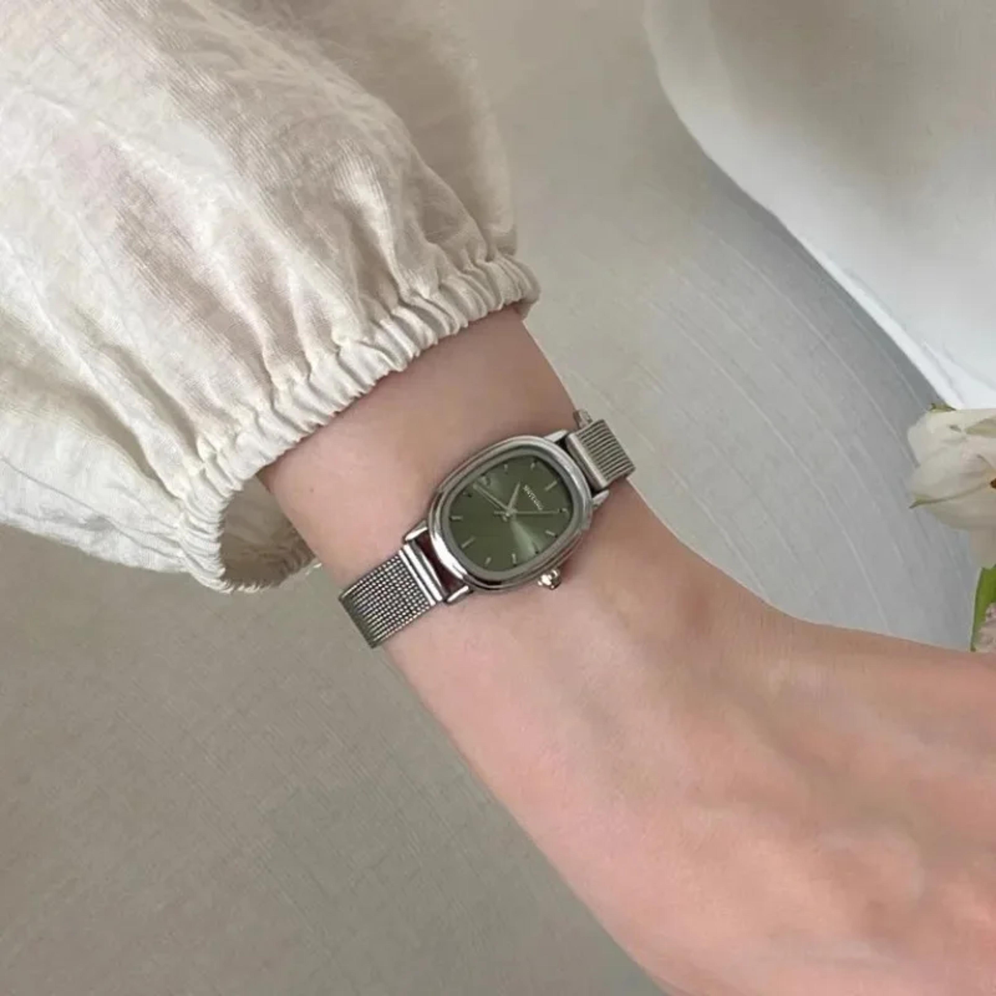 elegant green oval dial stainless steel ladies quartz watch