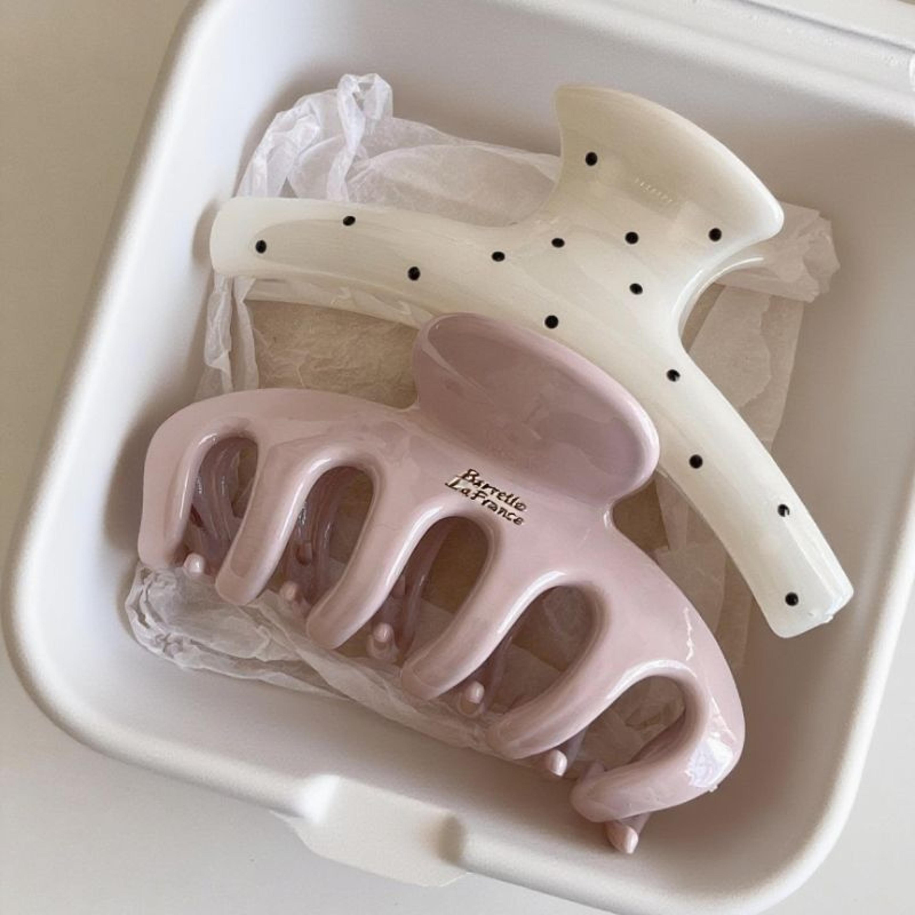 large acrylic hair claw with geometric polka point arc design