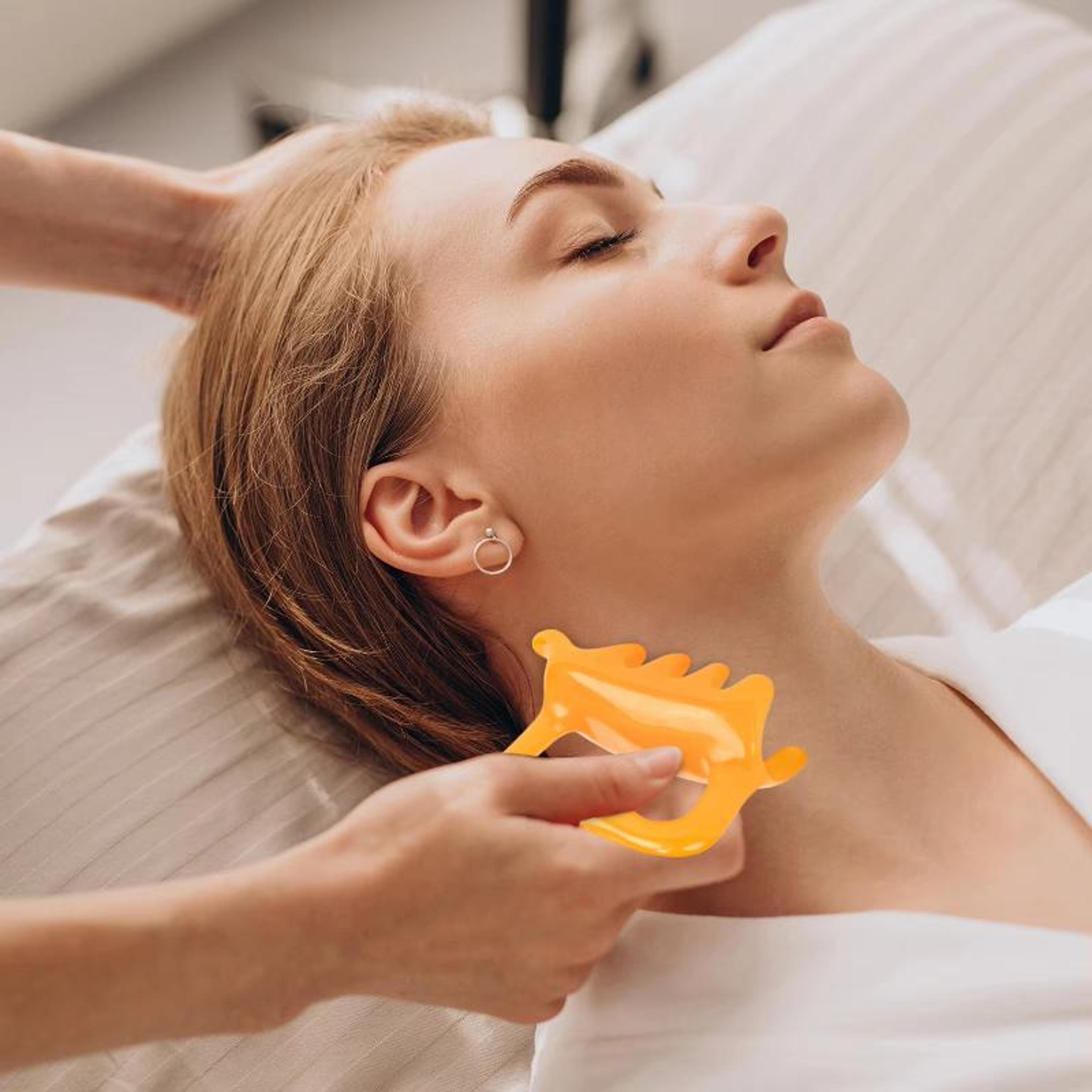 ergonomic facial massage tool for skincare and muscle relaxation