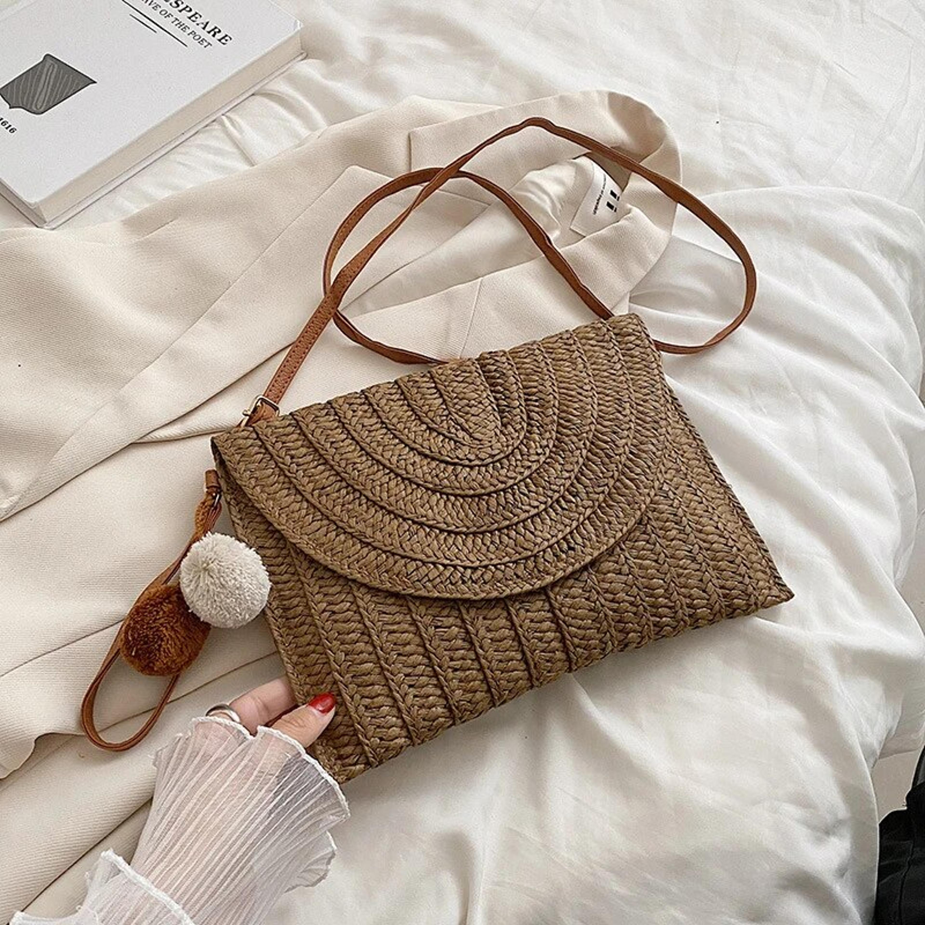 handmade straw crossbody bag woven beach clutch with pom pom charm