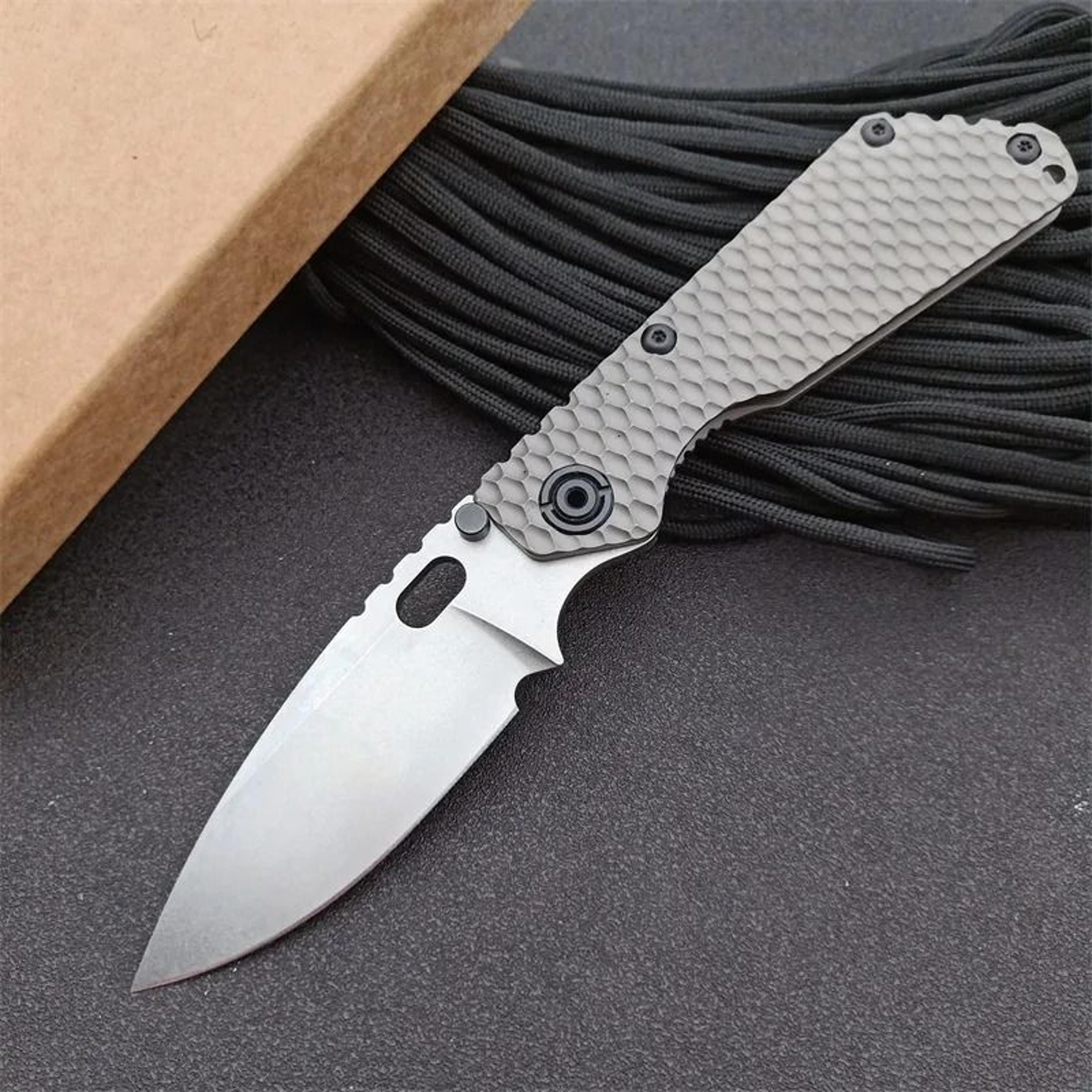 steel pocket folding knife with titanium alloy handle stonewashed blade