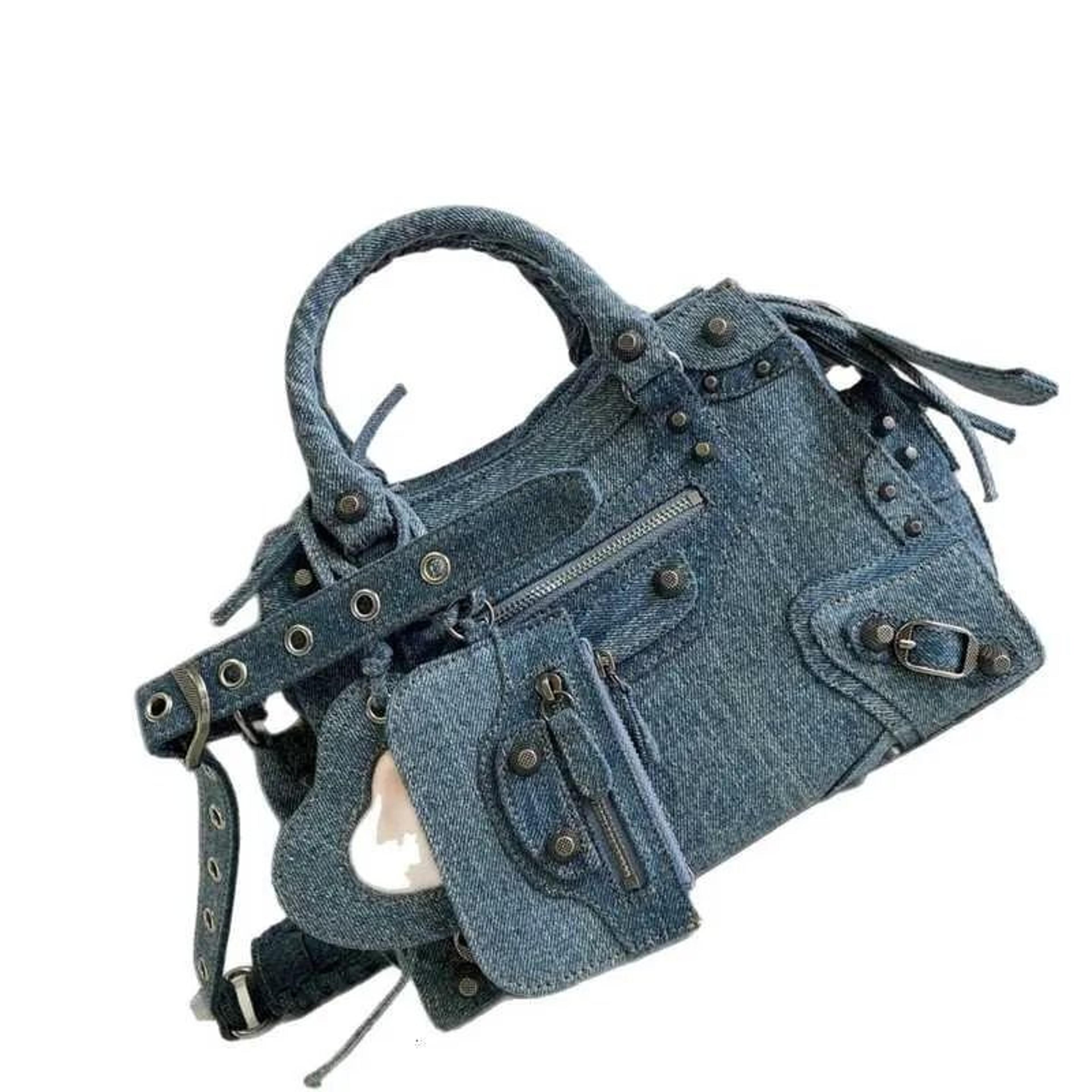 rhinestone denim shoulder bag with rivet detail and zipper closure