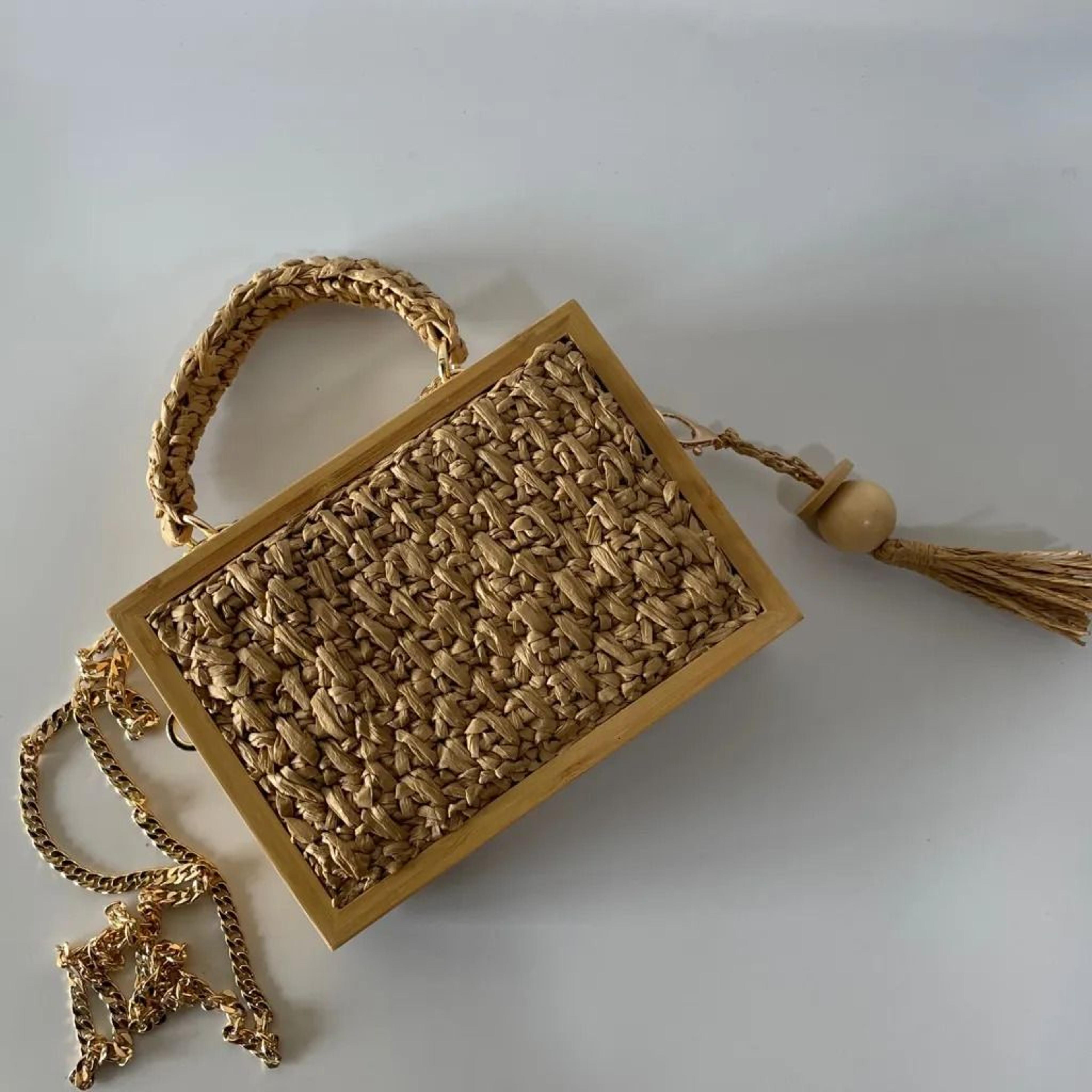 straw woven crossbody bag with bamboo tassel and chain strap